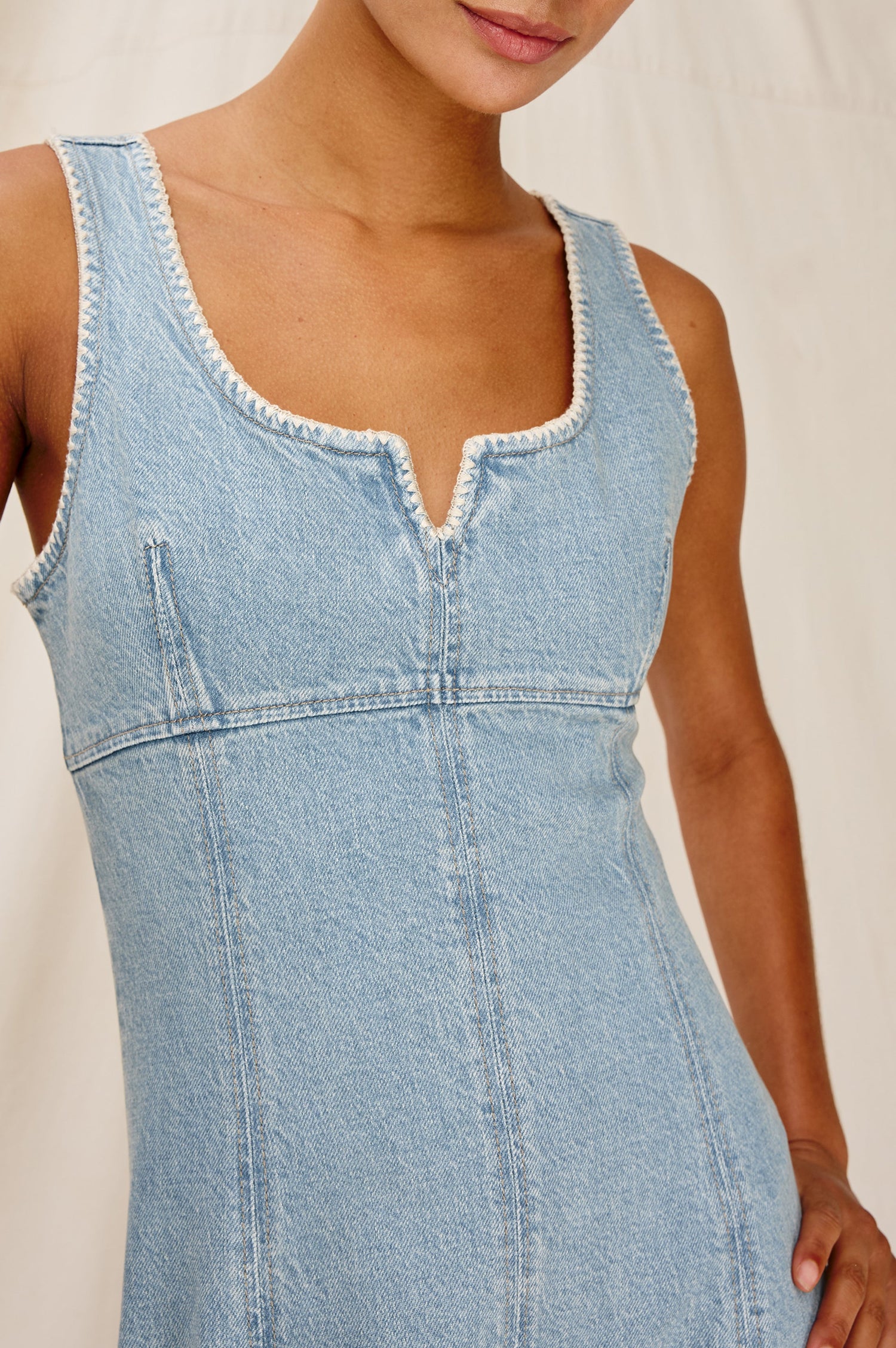 Cove Denim Tank Dress with a Scoop Split neck, Empire Bust, A-line and Above-Knee Length in Capri Colorway. Front Detailed View Shown on Model.