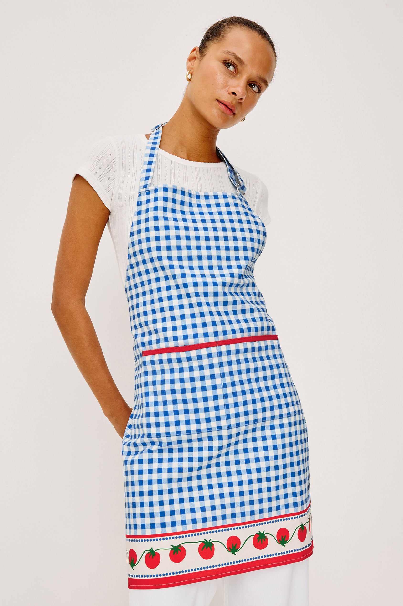 Cucina Apron in Cotton With Adjustable Halter Strap and Adjustable Back Ties in Gingham Tomatoes Colorway - Upper Body Front View Featured on Model