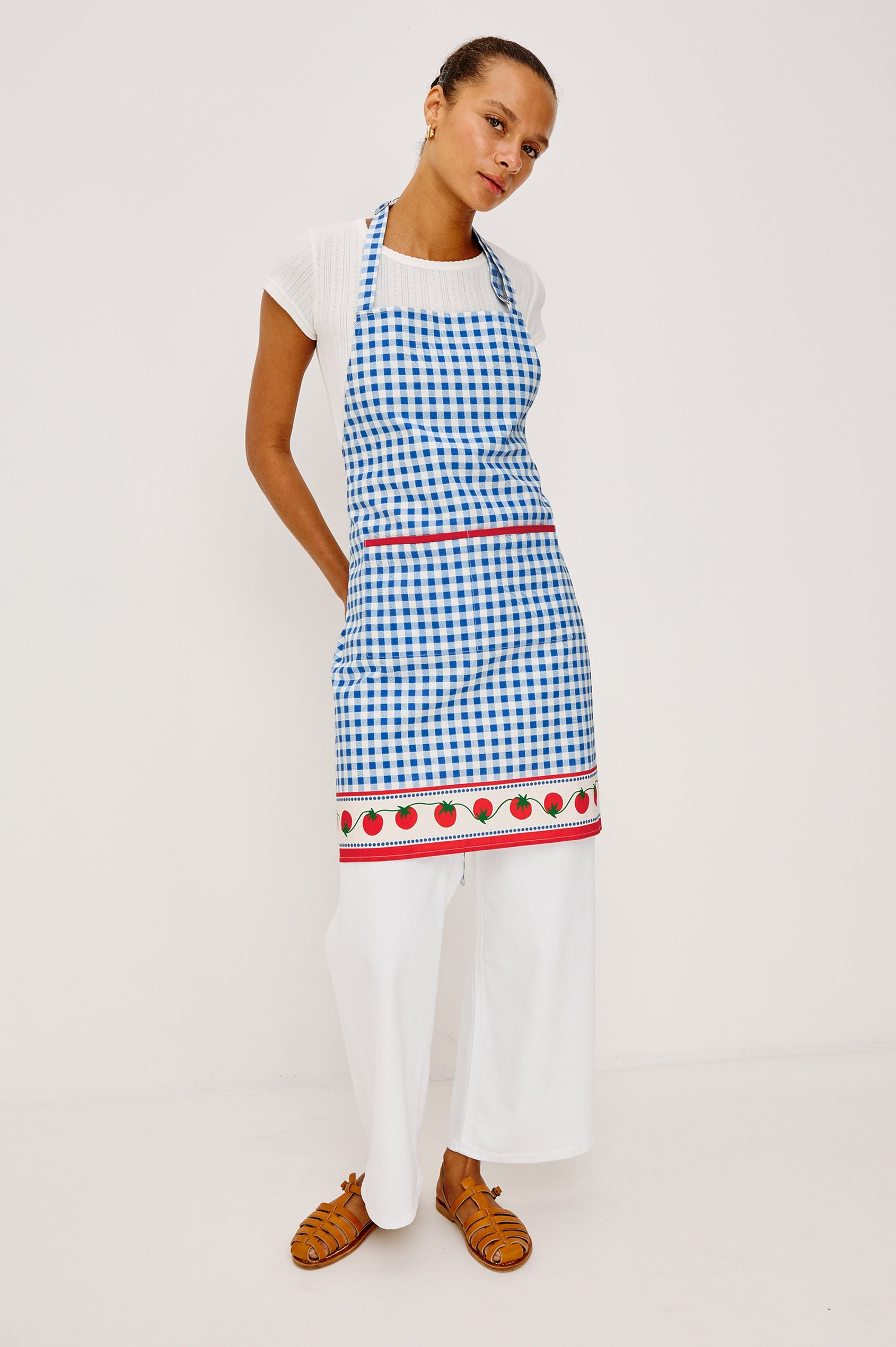 Cucina Apron in Cotton With Adjustable Halter Strap and Adjustable Back Ties in Gingham Tomatoes Colorway - Full Body Front View Featured on Model