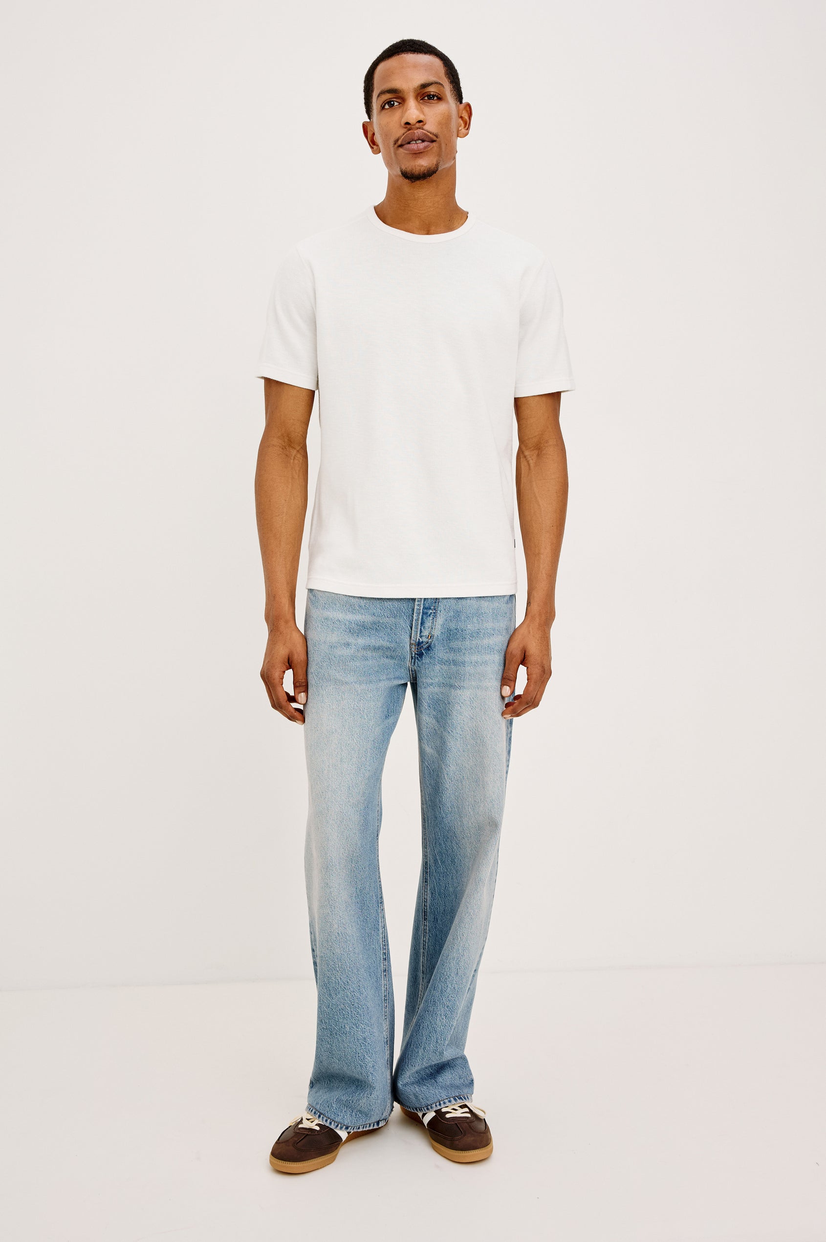 Cutler '90s Loose Jean in Rigid Denim With Loose Legs, Light Distressing, Front Zip Fly, and 5-Pockets in Medium Vintage Wash Colorway - Full Body Front View Featured on Model