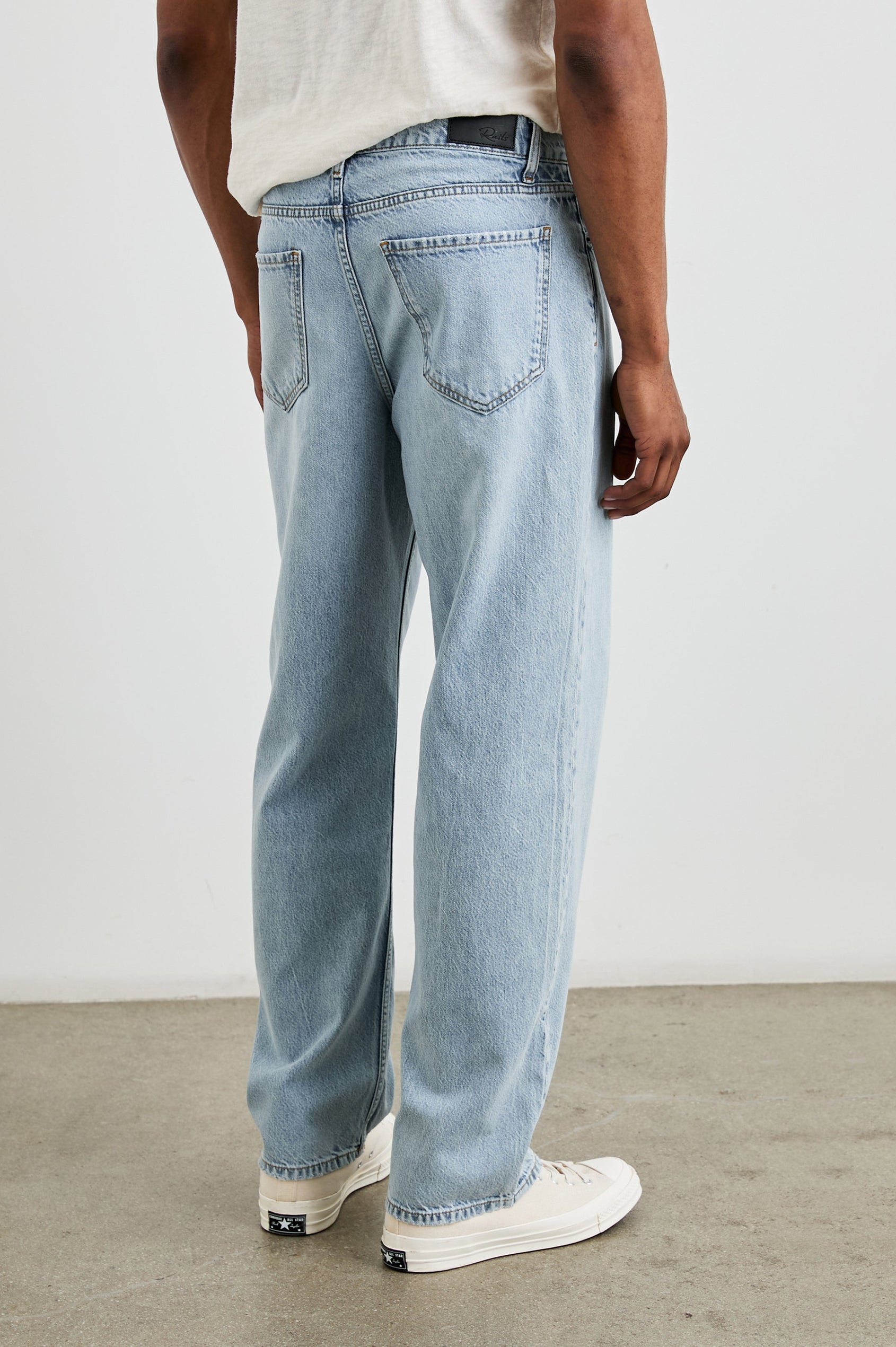 Cutler 90's Loose Jeans with Belt Loops, Two Front Pockets plus a Coin Pocket and Two Back Patch Pockets in Vintage Light Wash Colorway - Back View Featured on Model