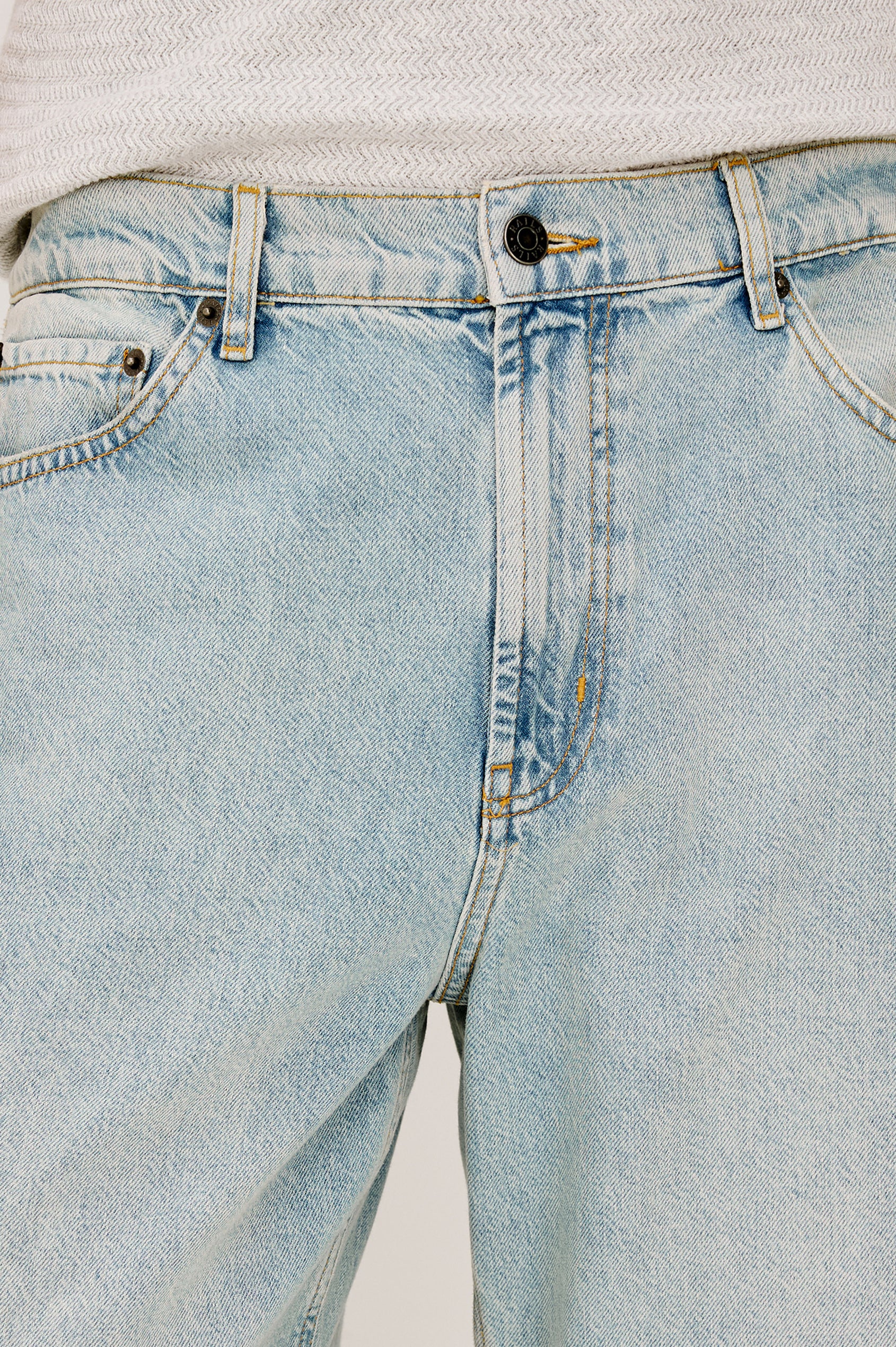Cutler 90's Loose Jeans with Belt Loops, Two Front Pockets plus a Coin Pocket and Two Back Patch Pockets in Vintage Light Wash Colorway - Front View Featured on Model