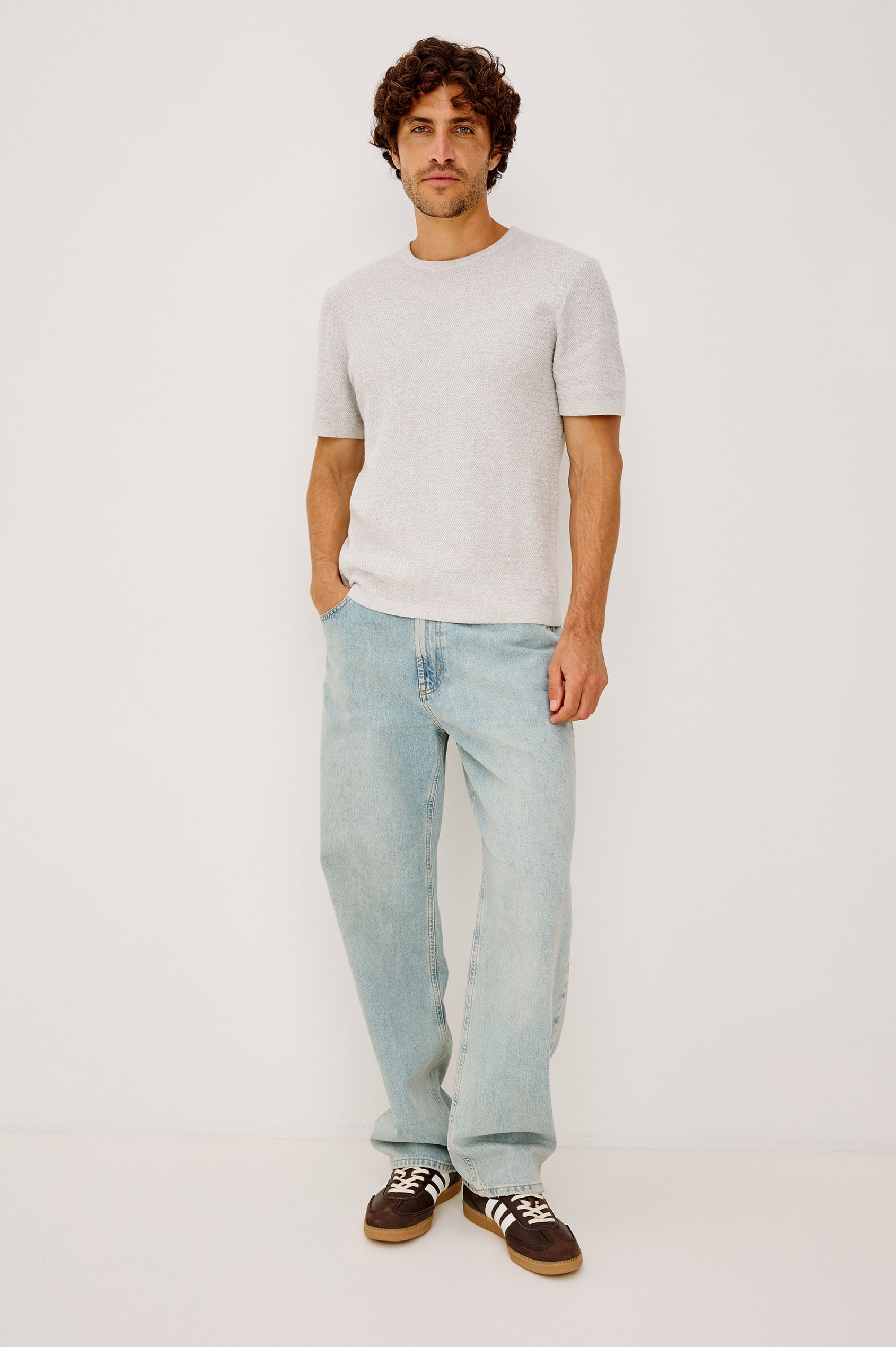 Cutler 90's Loose Jeans with Belt Loops, Two Front Pockets plus a Coin Pocket and Two Back Patch Pockets in Vintage Light Wash Colorway - Full Body View Featured on Model