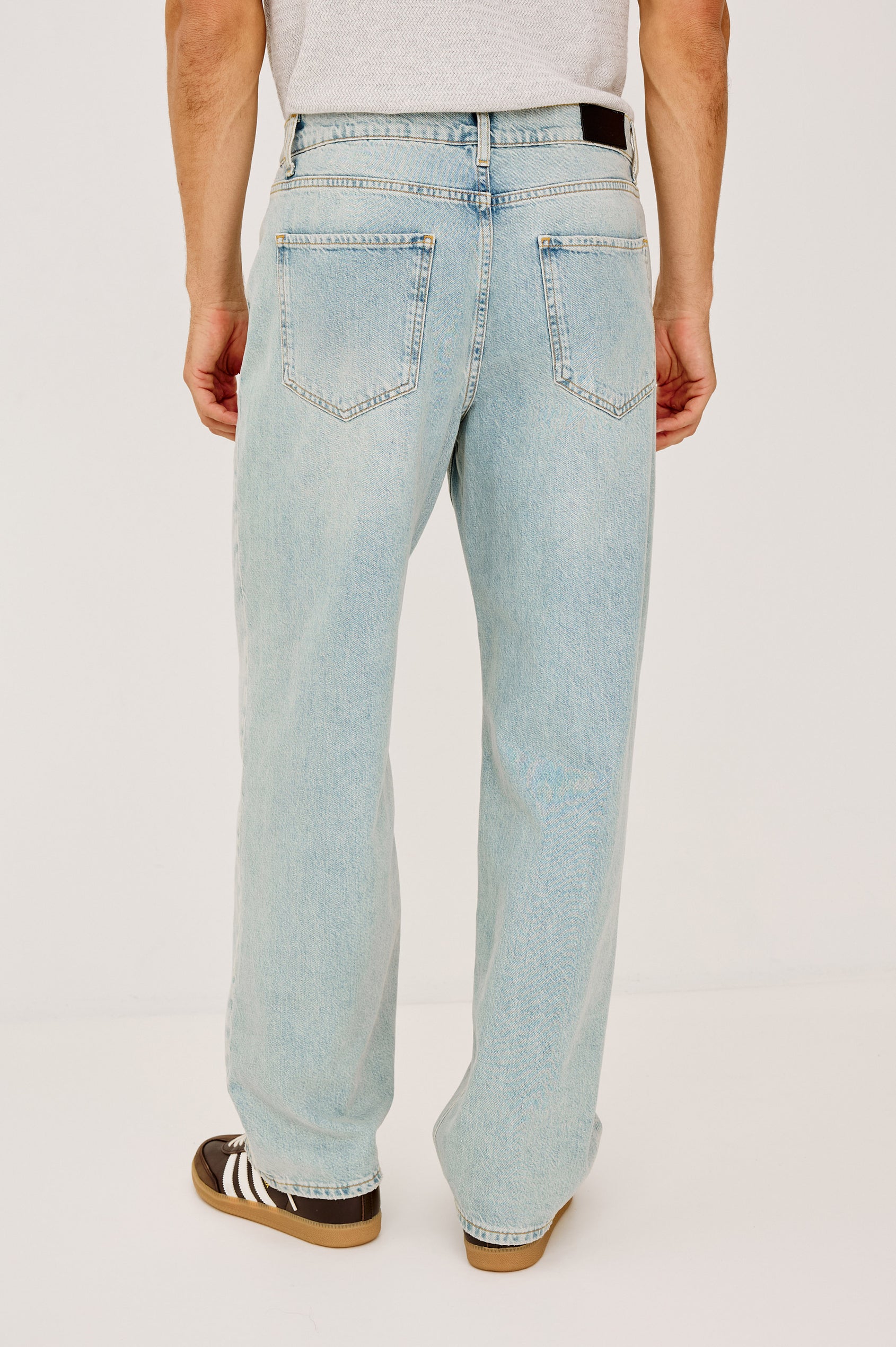 Cutler 90's Loose Jeans with Belt Loops, Two Front Pockets plus a Coin Pocket and Two Back Patch Pockets in Vintage Light Wash Colorway - Back View Featured on Model