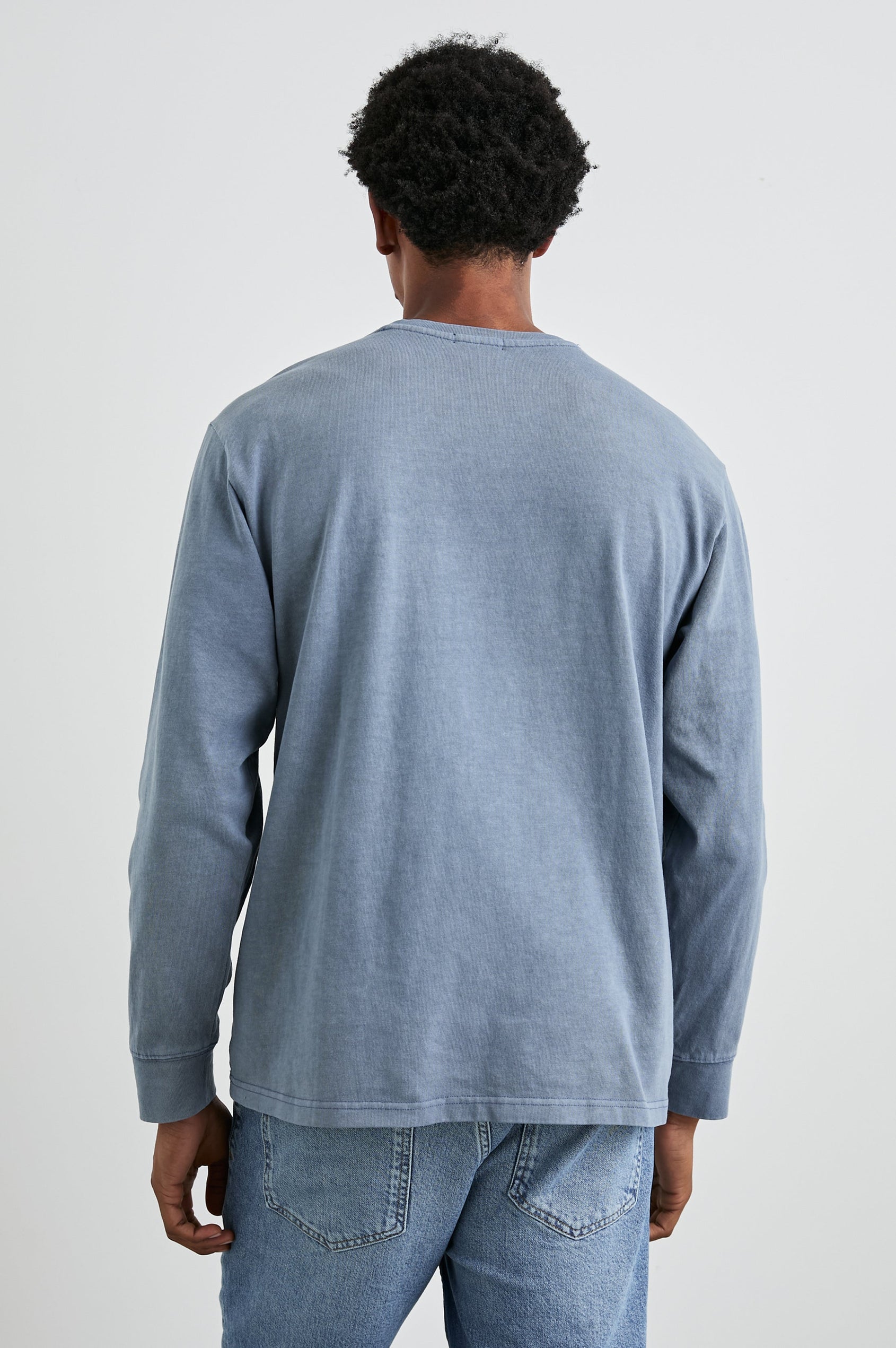 Cyd Long Sleeve Crew Neck T-Shirt  with a Chest Patch Pocket in Steel Colorway - Back View Featured on Model