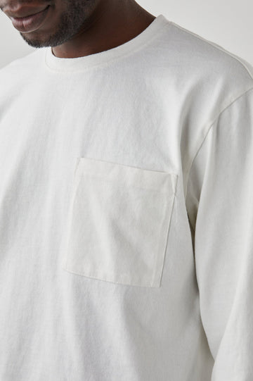 Cyd Long Sleeve Crew Neck T-Shirt  with a Chest Patch Pocket in White Colorway - Front View Featured on Model