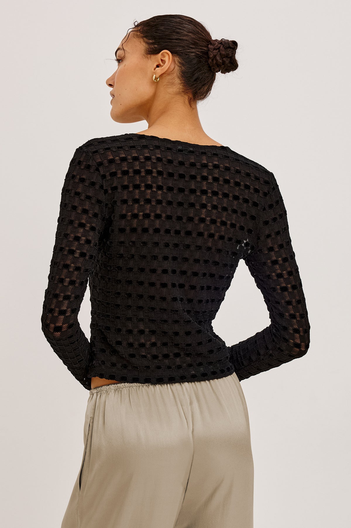 Cyrah Cardigan in Sheer Stretch Lace With Fitted Long Sleeves, and Front Button-and-Loop Closures in Black Checkerboard ColorwayUpper Body Back View Featured on Model.