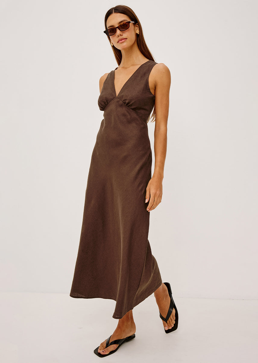 Woman wearing a brown linen maxi dress