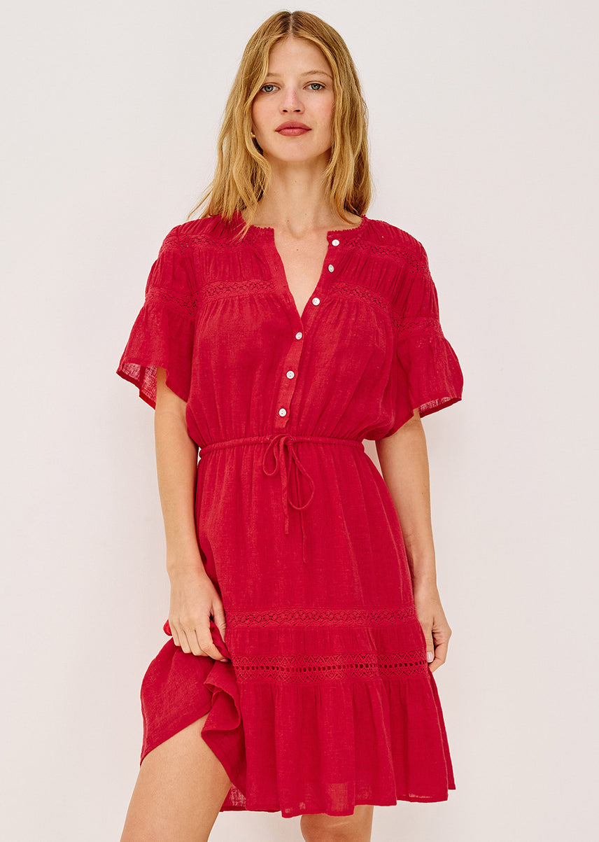 Woman wearing a red dress with a white background