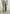 MALE MODEL WEARING GARRETT PANT (STRAIGHT WIDE LEG PANT) IN COLOR SPRING OLIVE (GREEN)