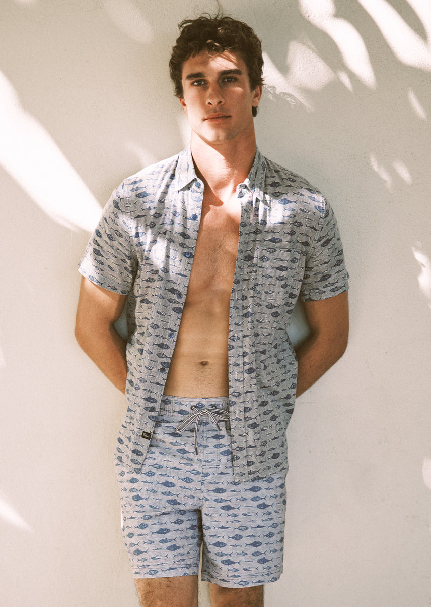 Man wearing a matching set with fish all over it