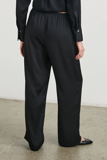 Damini Pants with a Drawstring Waist and Two Front Pockets in Black Colorway - Back View Featured on Model