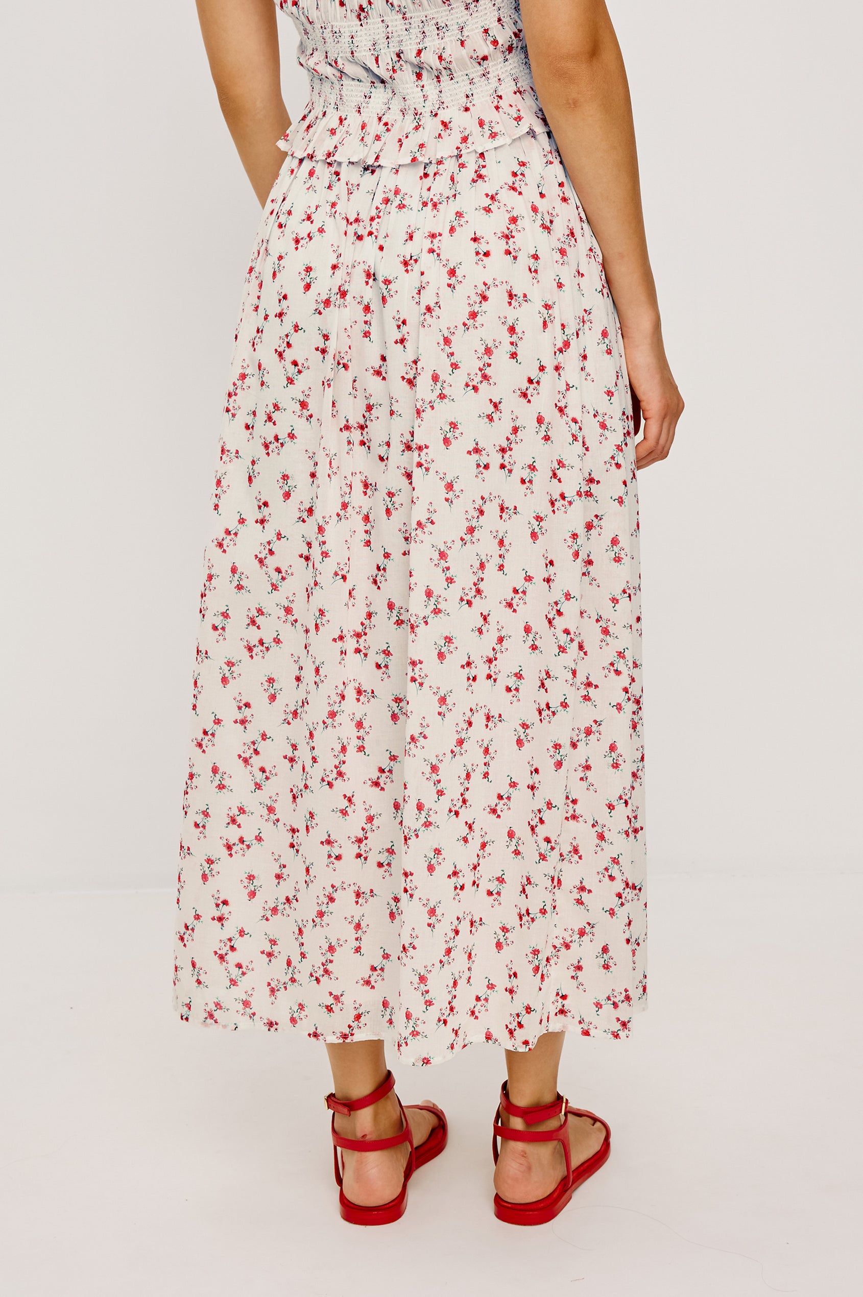 Dax A-Line Maxi Skirt With Grid and Floral Cutwork Embroidery Elastic Waistband and is Fully Lined in Berry Hibiscus Floral Embroidery Colorway - Lower Body Back View Featured on Model