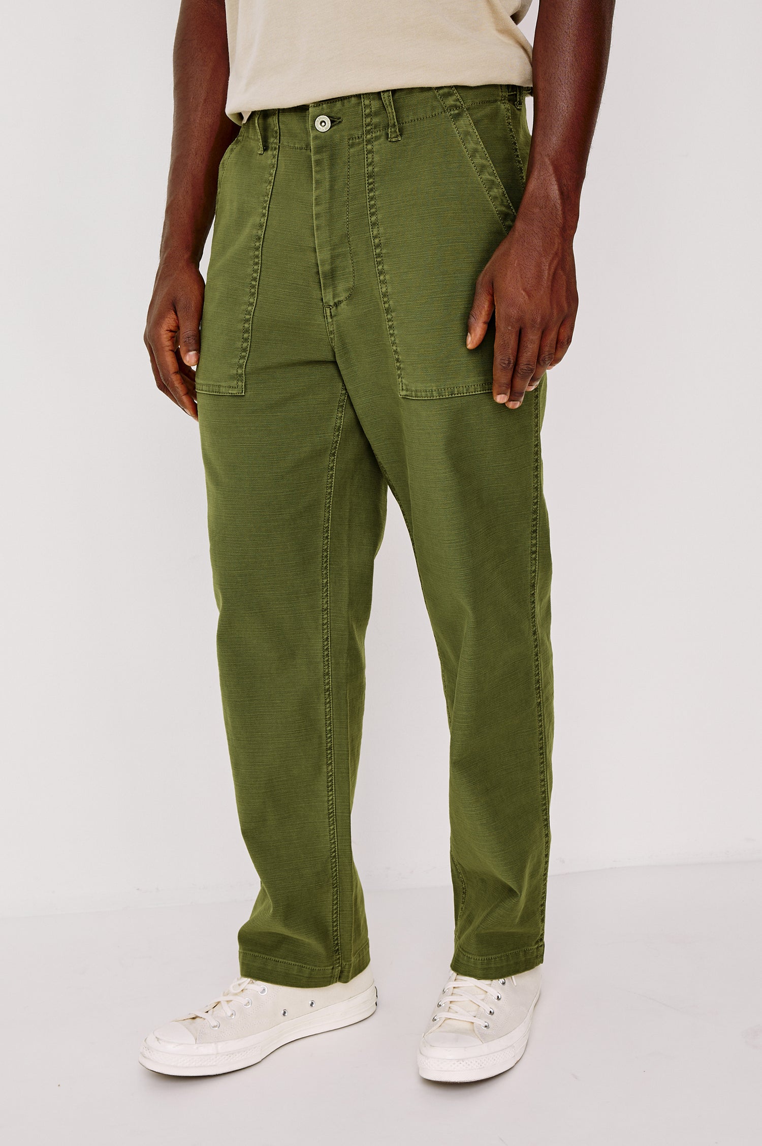 Decker Relaxed Straight Leg Workwear Pant in Stretch Cotton With Lived-In Wash, Zip Fly, and Side and Back Buttoned-Flap Pockets in Olive Colorway - Lower Body Close Up Front View Featured on Model