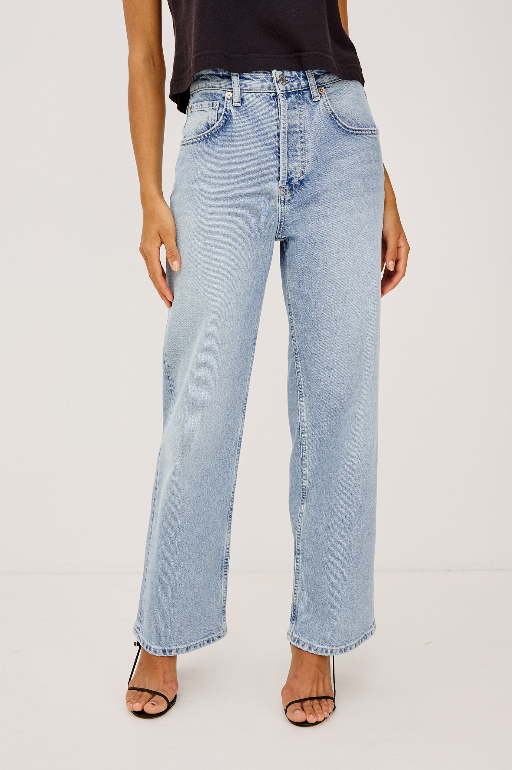 Del Mar Boyfriend Wide Leg Jean in Light Stretch Denim With Low-Slung Fit, Relaxed Fit, Vintage Wash, Button Fly, Belt Loops, 5-Pockets, and Distressed DEtailing in Jasper Colorway - Lower Body Front View Featured on Model