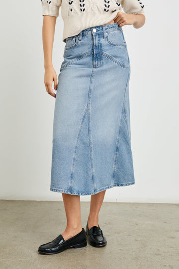 Del Rey Denim Midi Skirt with Western-Style Seams, Belt Loops, Two Front Pockets and Two Back Patch Pockets in Original Blue Colorway - Front View Featured on Model