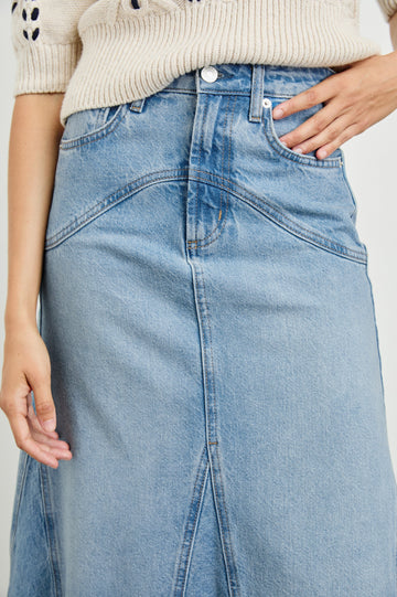 Del Rey Denim Midi Skirt with Western-Style Seams, Belt Loops, Two Front Pockets and Two Back Patch Pockets in Original Blue Colorway - Front View Featured on Model