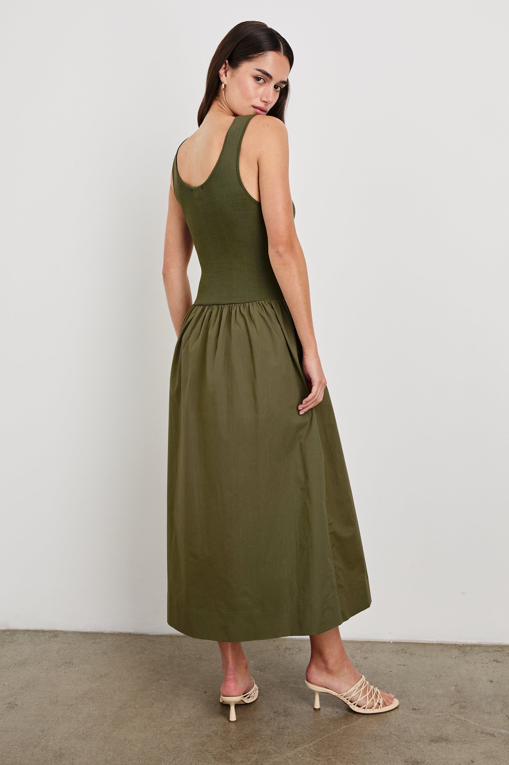 Dia tank midi dress with scoop neck and fitted bodice in Olive colorway - back view on model