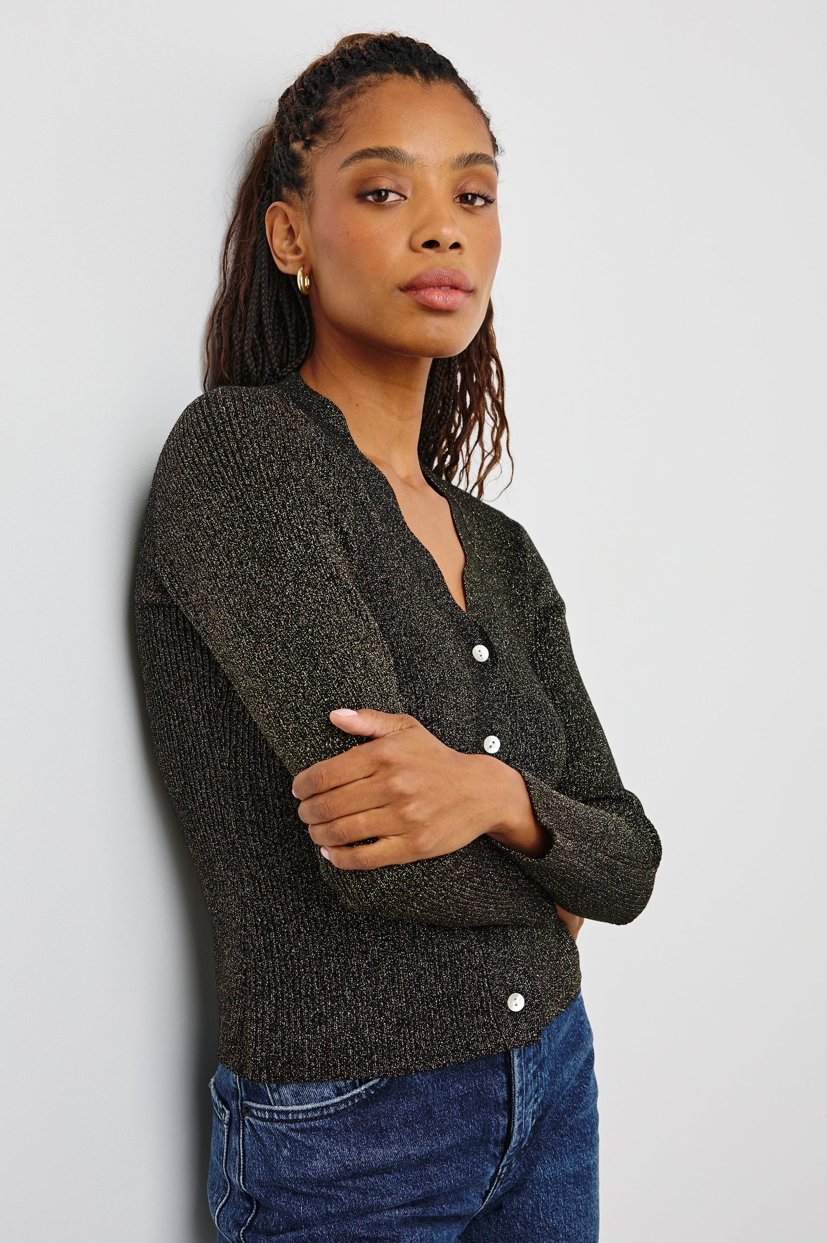Dita Long-Sleeve Cardigan with Button Closure, a V neck and Scalloped Trim along the Neckline and Closure in Gold Lurex Colorway - Side View Featured on Model
