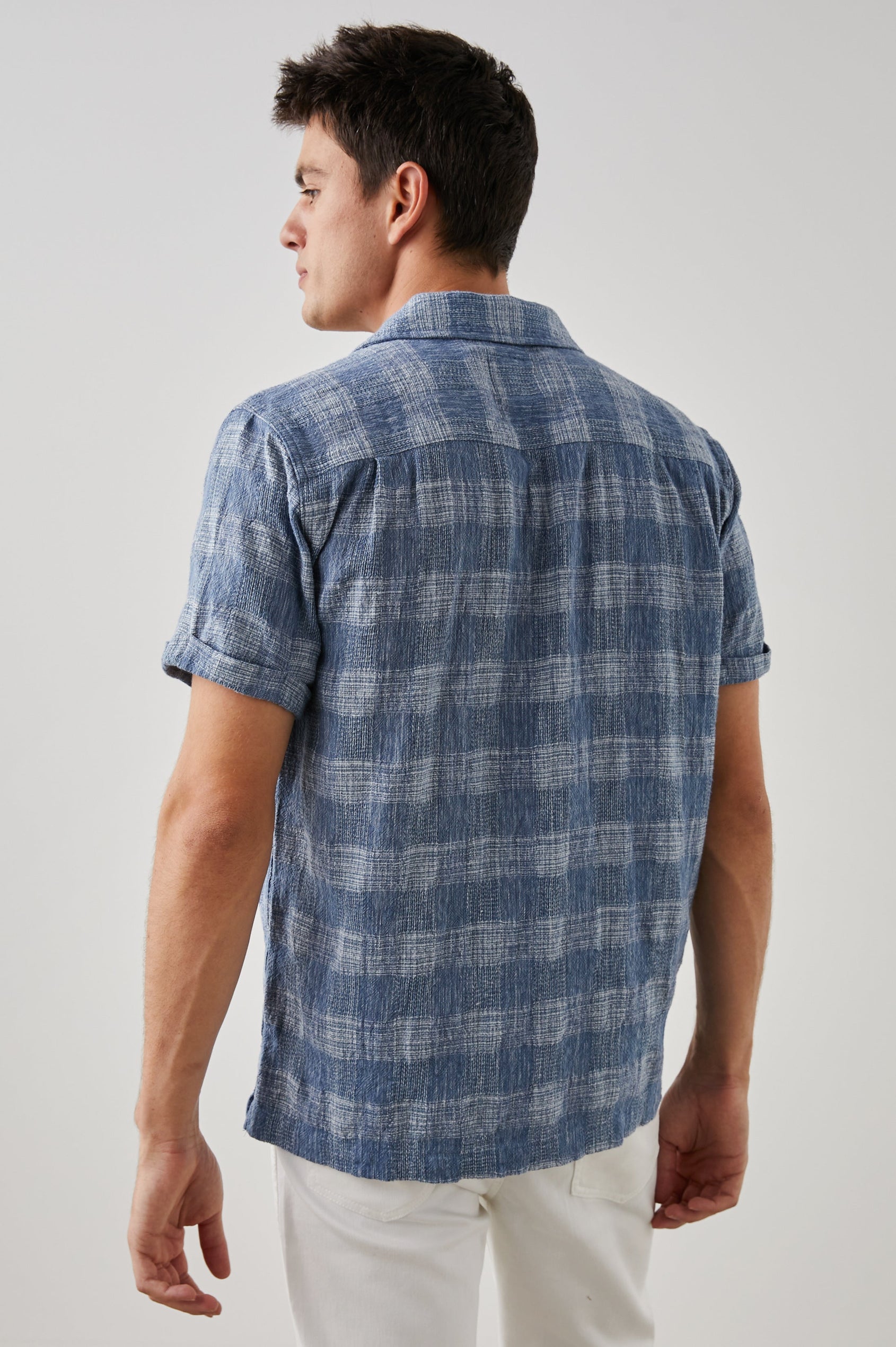Dresden Short Sleeve Button Up with Rolled Cuffs in Kyoto Blue Colorway, a Blue and White Plaid - Back View Featured on Model