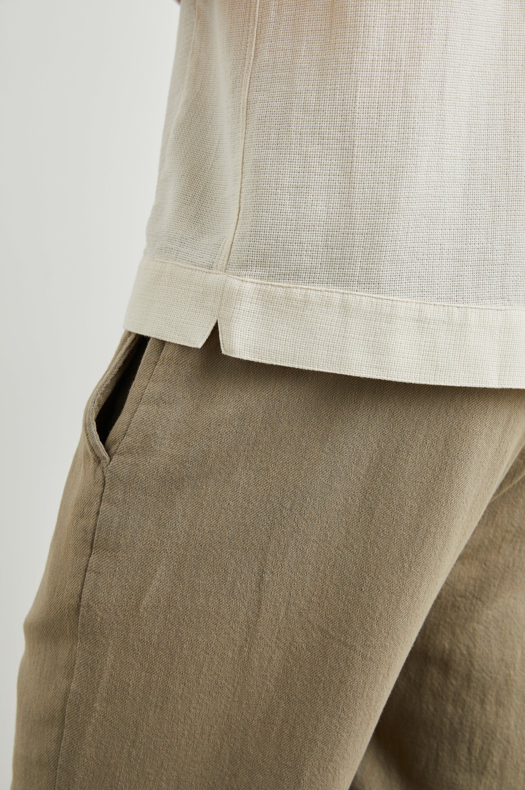 Duke Short Sleeve Button Up with Rolled Cuffs and in Parchment Wheat Colorway, Alternating Vertical Panels of Wheat and Parchment - Side View Featured on Model