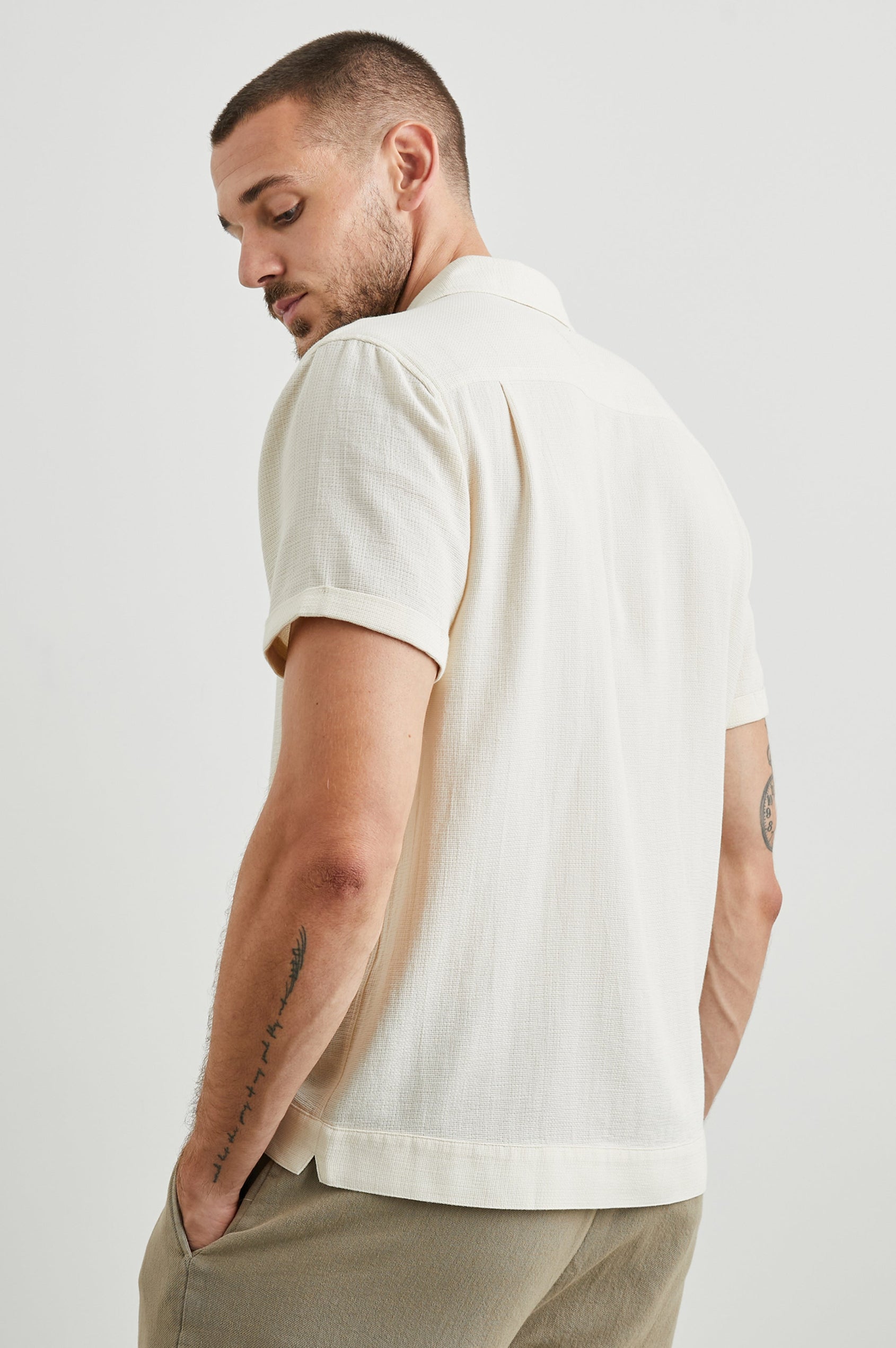 Duke Short Sleeve Button Up with Rolled Cuffs and in Parchment Wheat Colorway, Alternating Vertical Panels of Wheat and Parchment - Side View Featured on Model