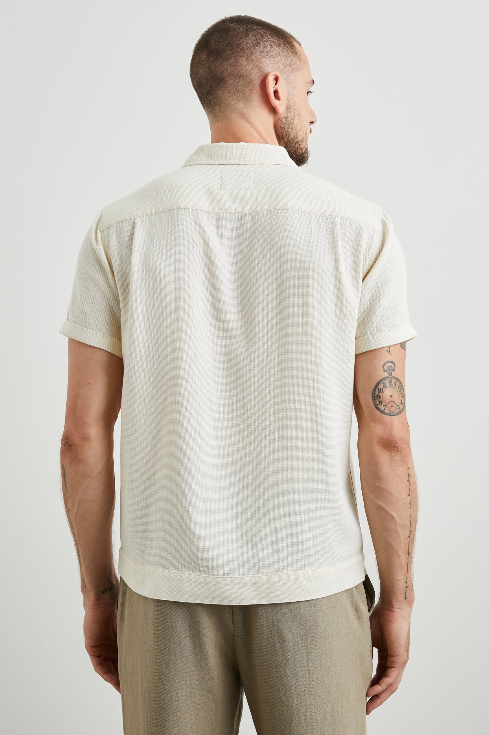 Duke Short Sleeve Button Up with Rolled Cuffs and in Parchment Wheat Colorway, Alternating Vertical Panels of Wheat and Parchment - Back View Featured on Model