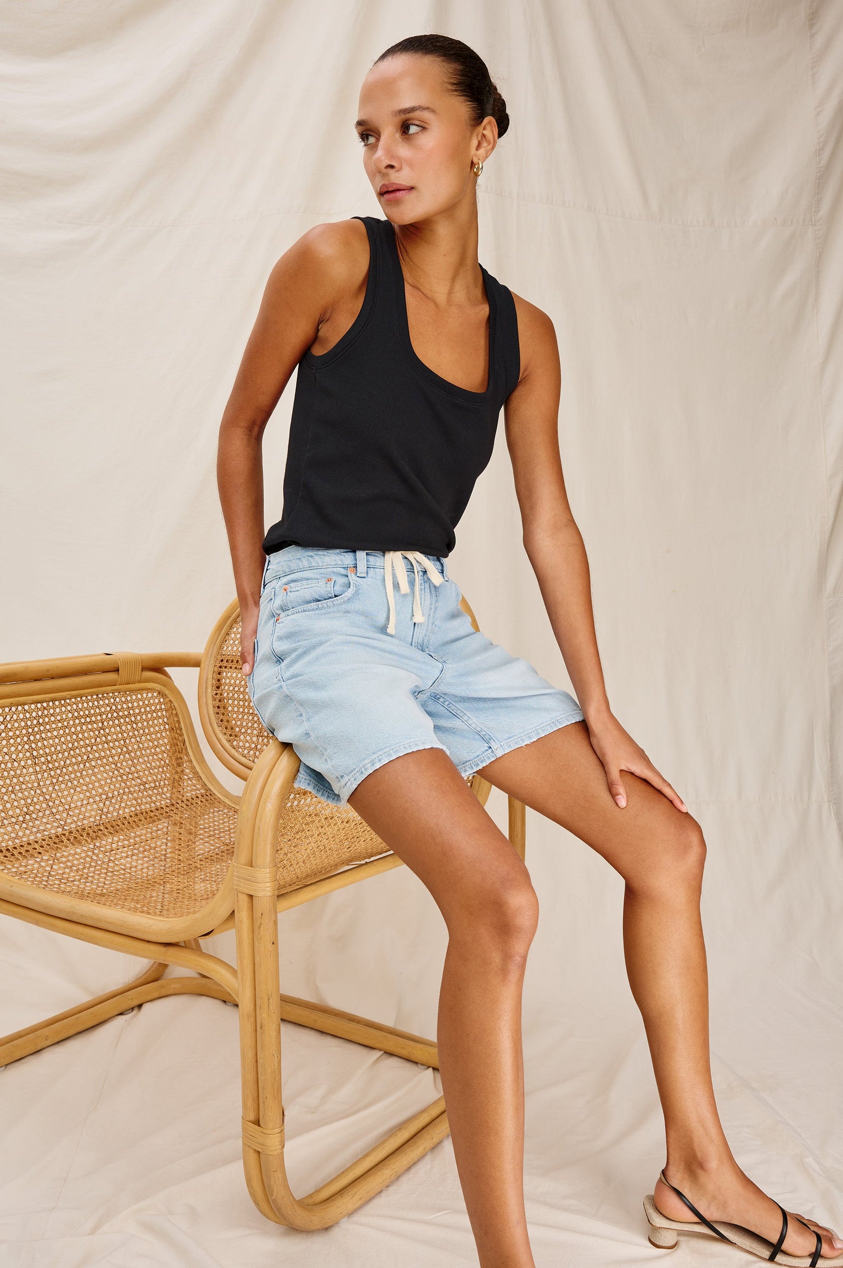 Dume Denim Short, Five Pocket, Zip Fly, Mid-Thigh Length with a White Drawstring Tie Waist in Light Wash Scuba Colorway. Front View Shown on Model.
