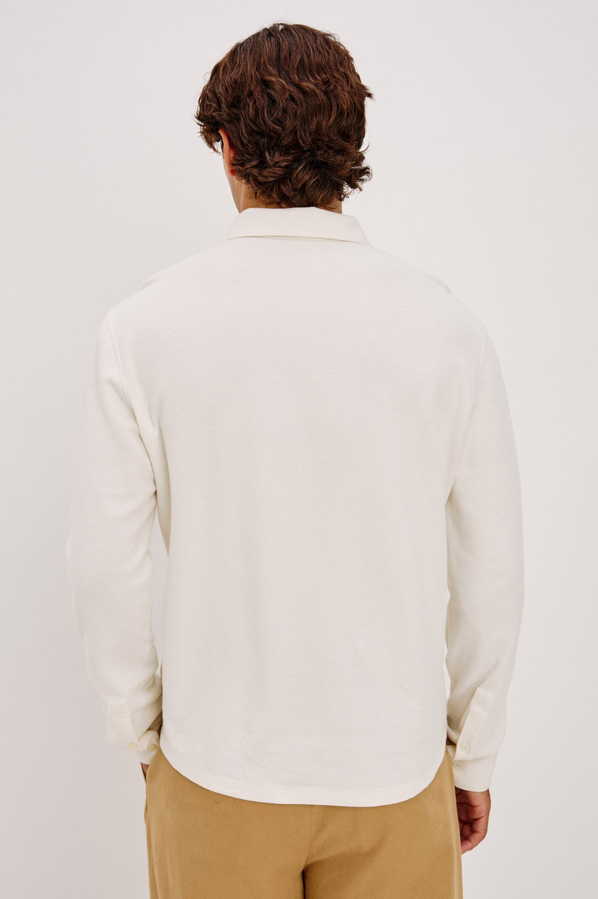 Dunn Shirt in Pique Knit With Front Buttons, Slim Fit, Collar, and Long Sleeves in White Colorway - Upper Body Back View Featured on Model.