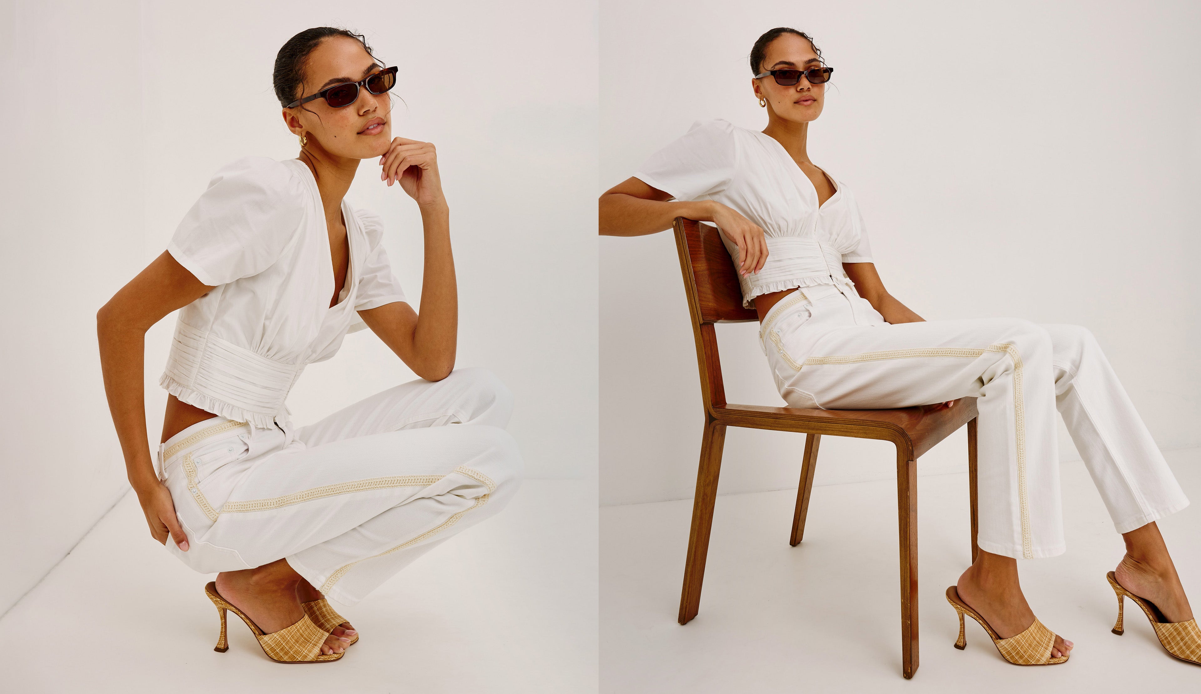 Woman in a white outfit with sunglasses sitting on a chair against a white background