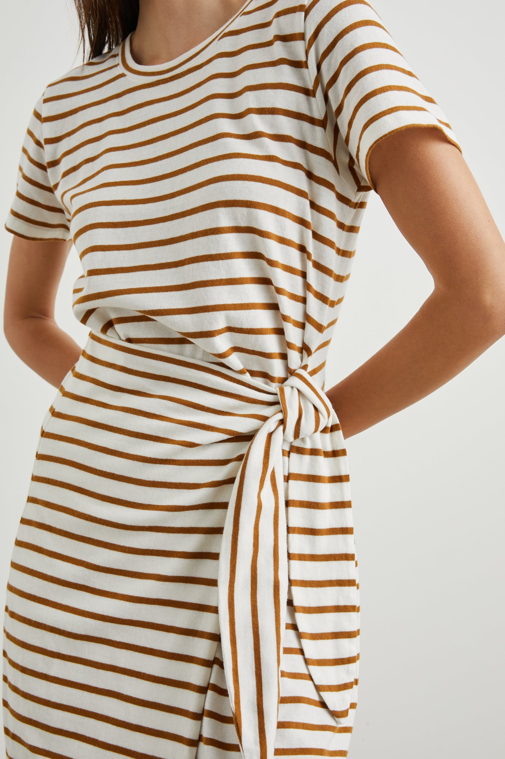 Edie Above-Knee Dress with Short Sleeves, Crew Neckline and Adjustable Wrap Tie At Waist in Carmel Stripe Colorway, Horizontal Carmel and Ivory Stripes - Front View Featured on Model