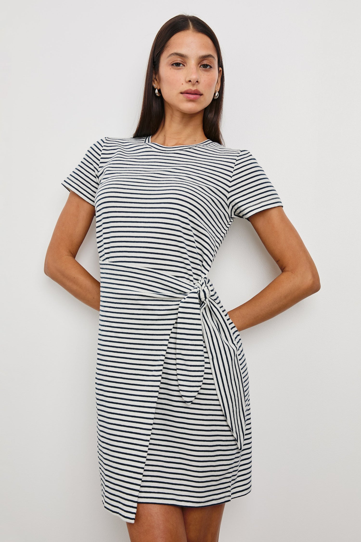 Edie Above-Knee Dress with Short Sleeves, Crew Neckline and Adjustable Wrap Tie At Waist in Ivory Navy Micro Stripe Colorway, Horizontal Stripes - Front View Featured on Model