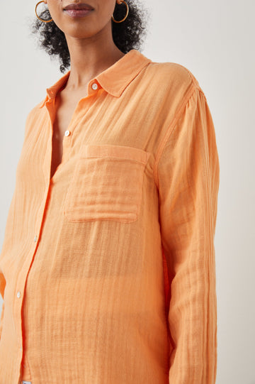 Ellis Long-Sleeve Button Down with Cuffs and a Patch Chest Pocket in Papaya Colorway - Front View Featured on Model