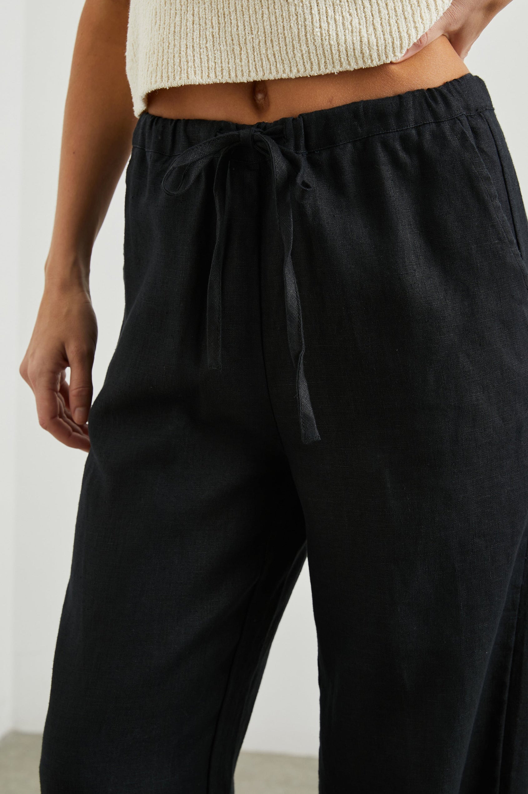 Emmie Pants with a Drawstring Waist and Two Front Pockets in Black Colorway - Front View Featured on Model