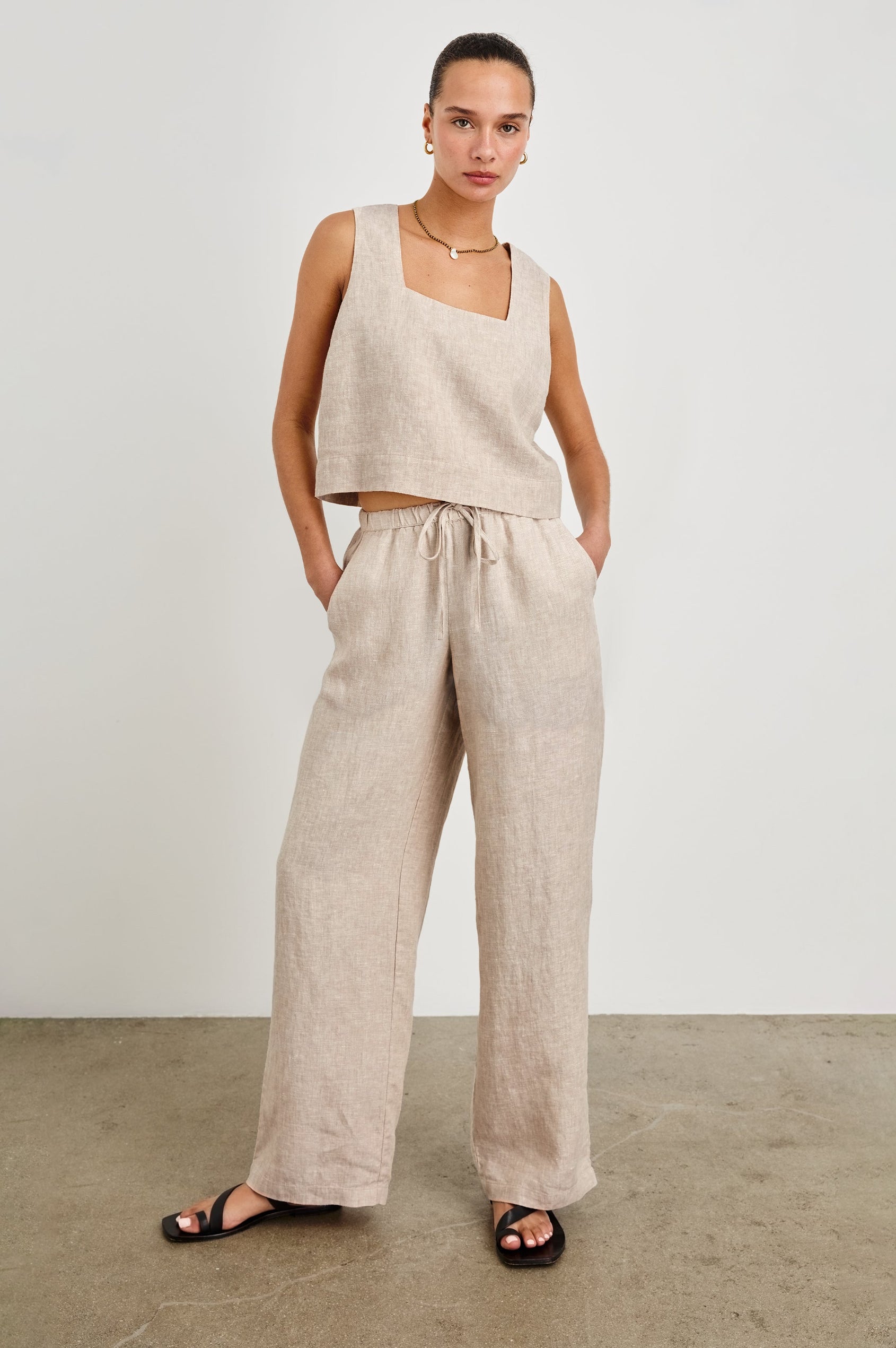 Emmie high rise linen wide leg pant with drawstring and Akira relaxed fit linen crop top with wide straps in Heathered Flax -  full body front view on model