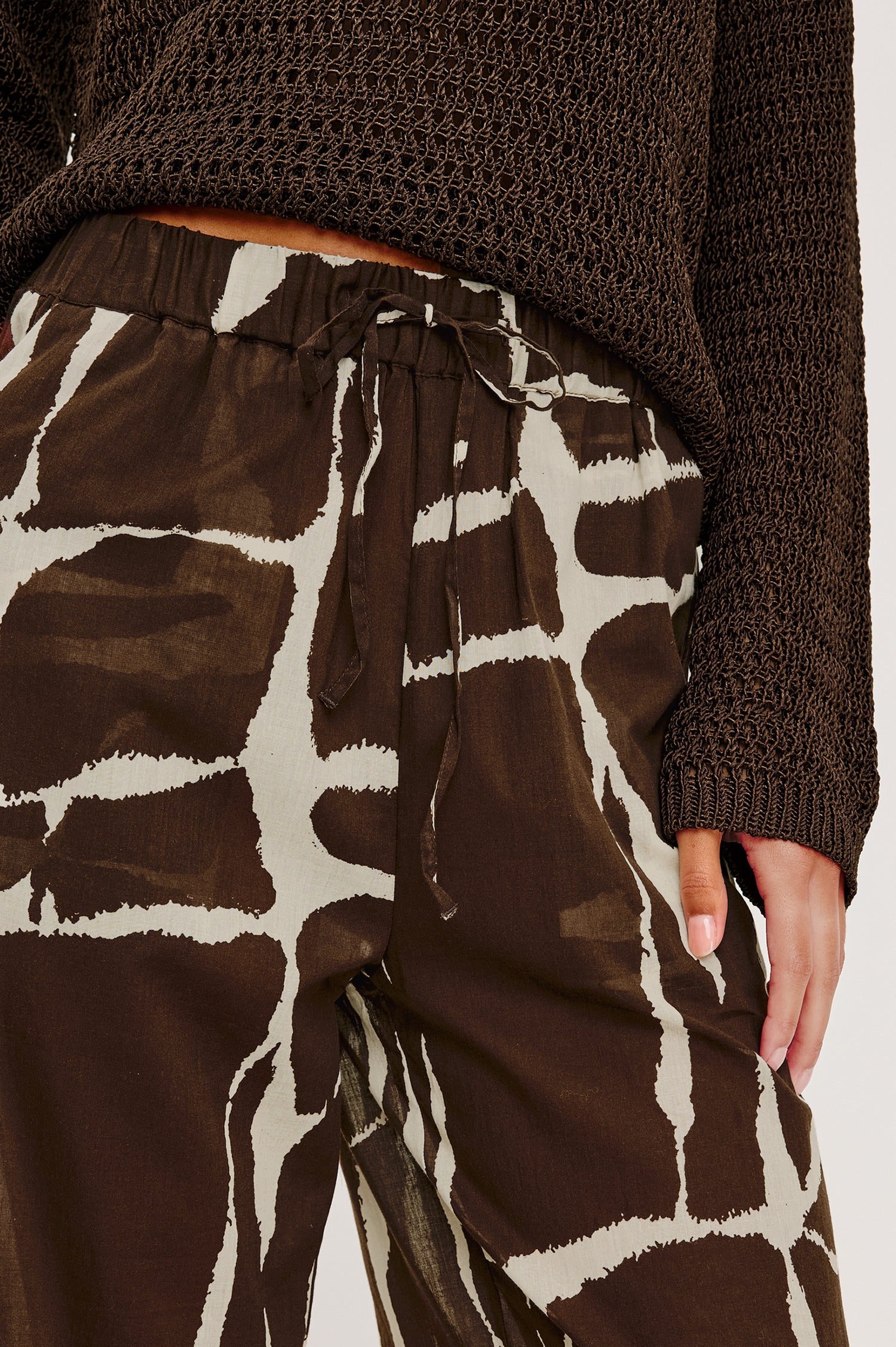 Emmie High-Waisted Wide-Leg Pant in Unlined Beach Cotton With Relaxed Fit Side Pockets and Adjustable Drawstring Waist Ties in Terra Colorway - Lower Body Close Up Front View Featured on Model