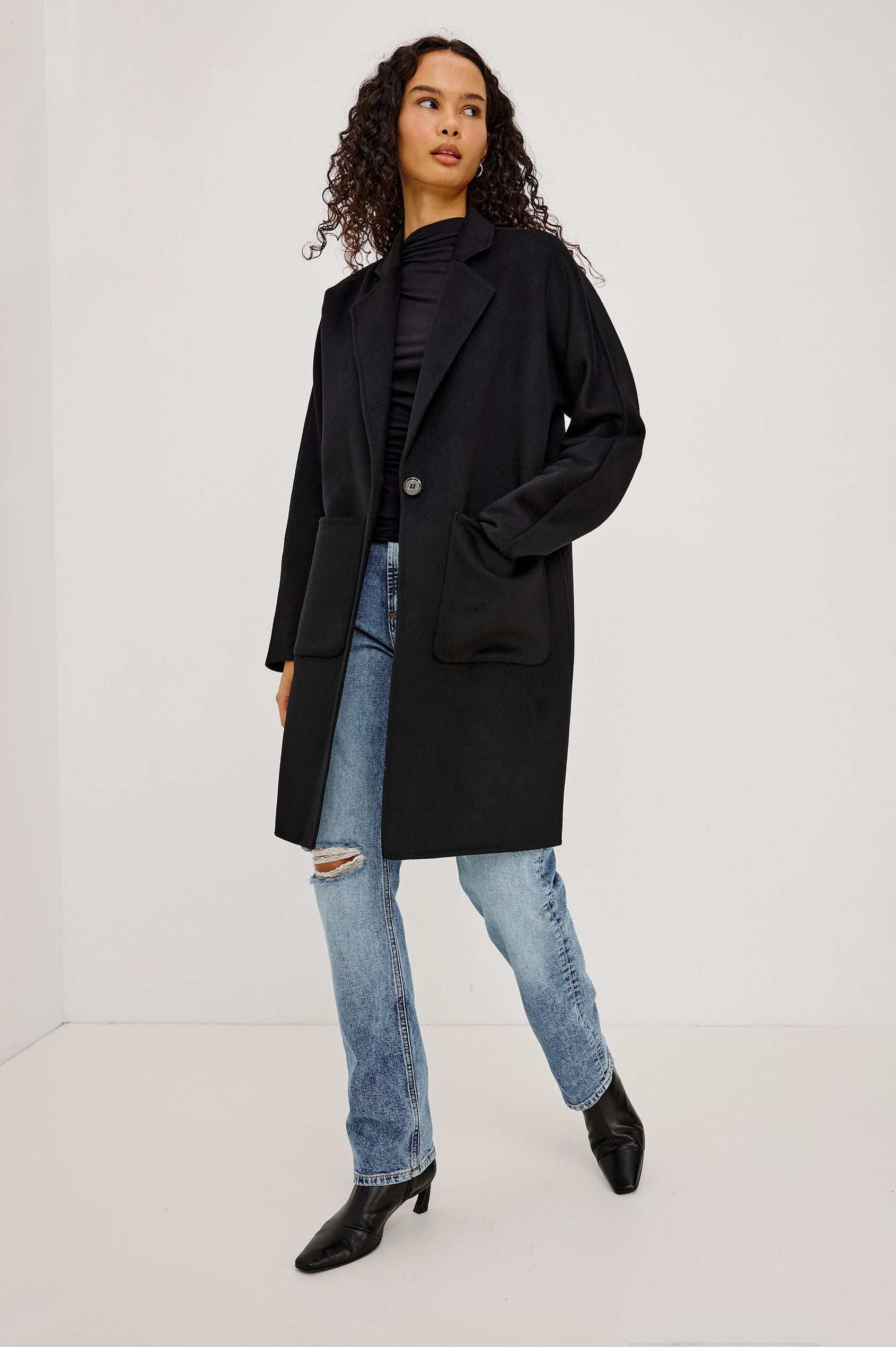 Everest Coat in Heavy Wool Blend With Longline Cut, Slightly Oversized Relaxed Fit, Lapel Collar, Single-Button Front, and Front Patch Pockets in Oat Camel Colorway - Full Body Front View Featured on Model