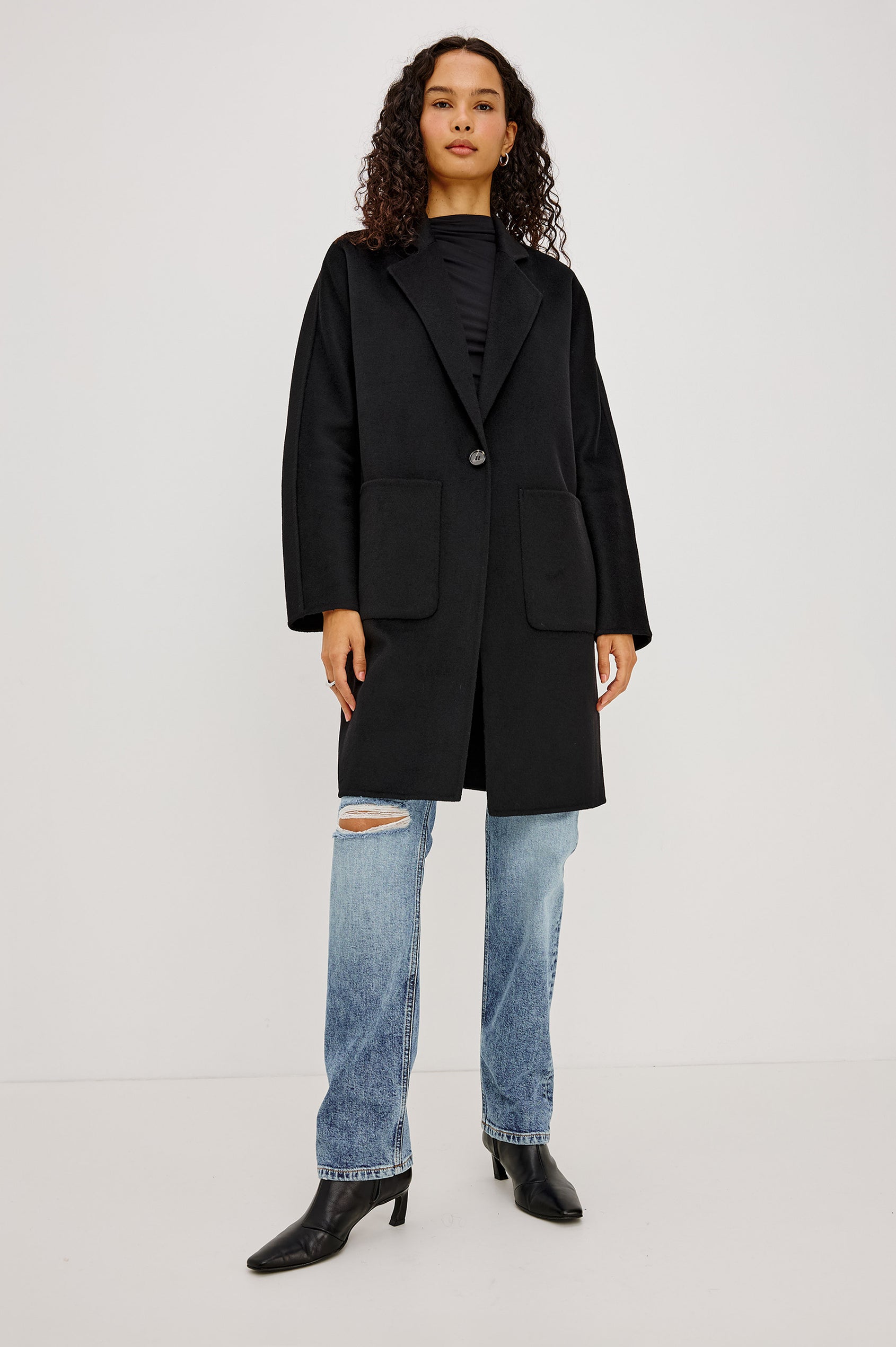 Everest Coat in Heavy Wool Blend With Longline Cut, Slightly Oversized Relaxed Fit, Lapel Collar, Single-Button Front, and Front Patch Pockets in Oat Camel Colorway - Full Body Front View Featured on Model