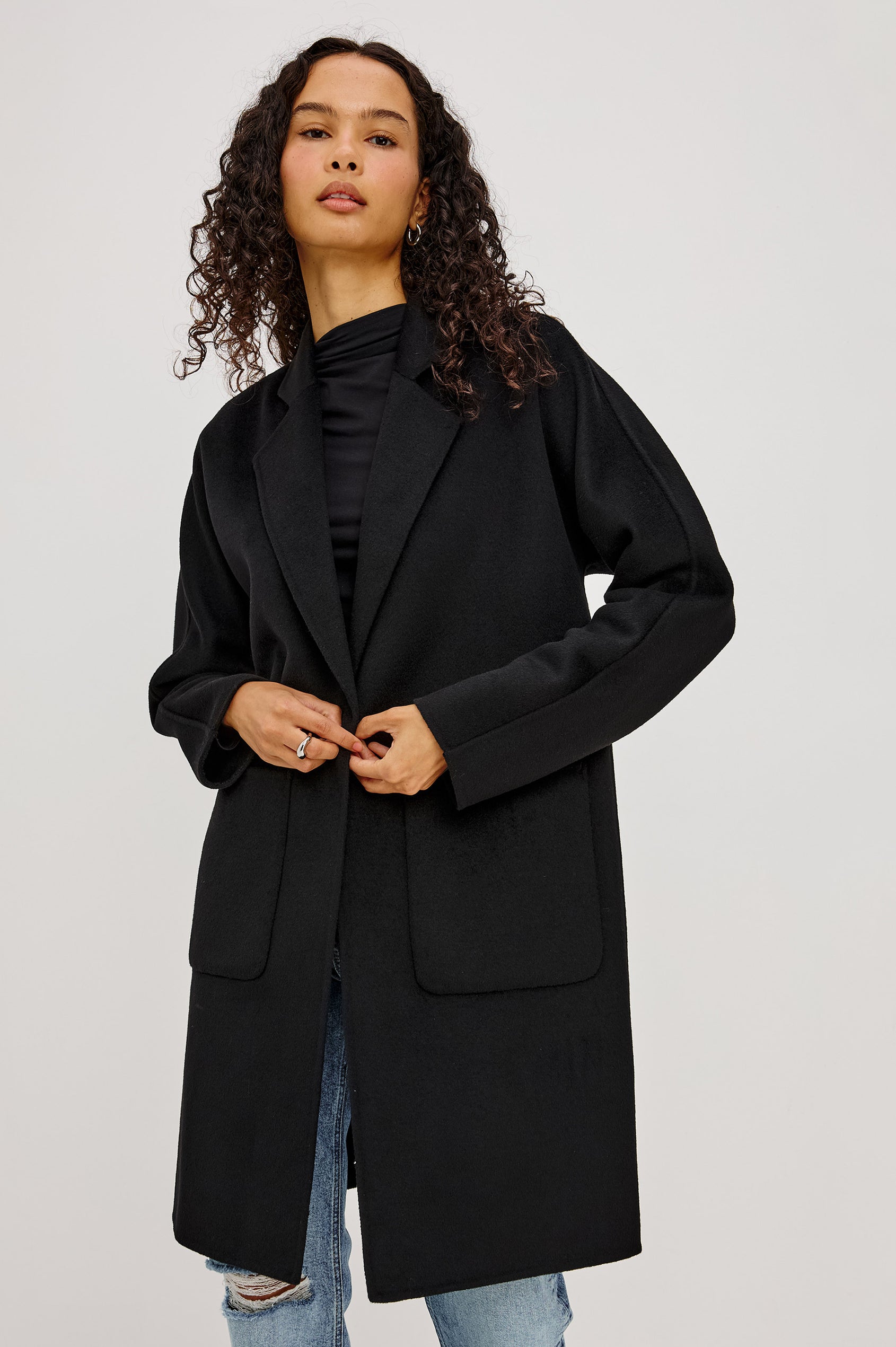 Everest Coat in Heavy Wool Blend With Longline Cut, Slightly Oversized Relaxed Fit, Lapel Collar, Single-Button Front, and Front Patch Pockets in Oat Camel Colorway - Upper Body Front View Featured on Model