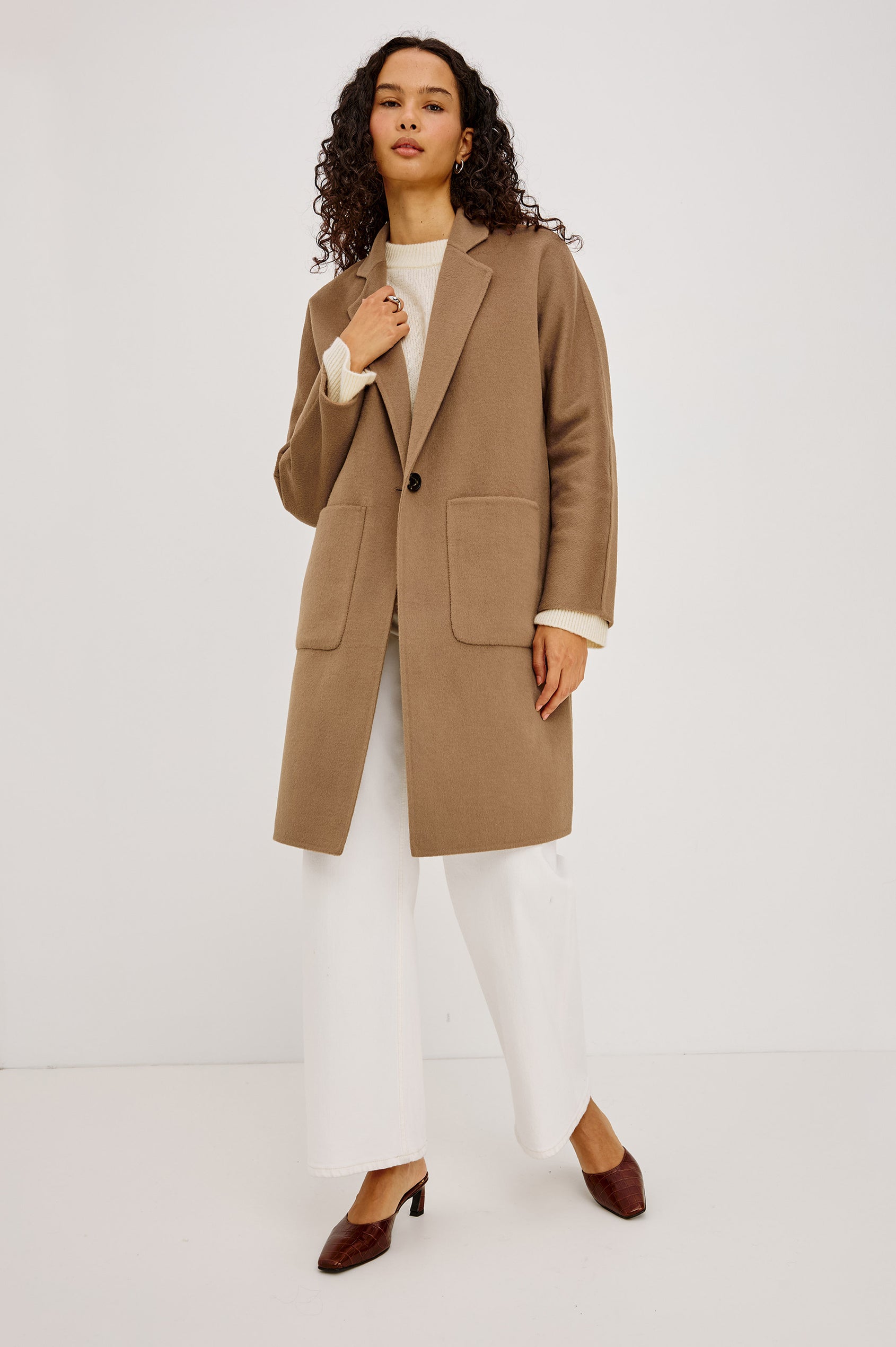 Everest Coat in Heavy Wool Blend With Longline Cut, Slightly Oversized Relaxed Fit, Lapel Collar, Single-Button Front, and Front Patch Pockets in Oat Camel Colorway - Full Body Front View Featured on Model