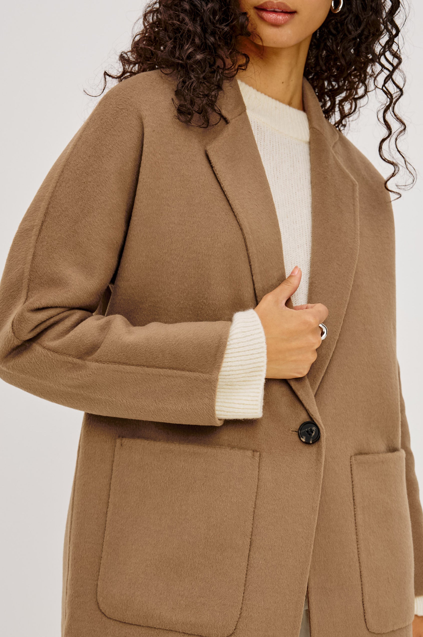 Everest Coat in Heavy Wool Blend With Longline Cut, Slightly Oversized Relaxed Fit, Lapel Collar, Single-Button Front, and Front Patch Pockets in Oat Camel Colorway - Upper Body Front View Featured on Model