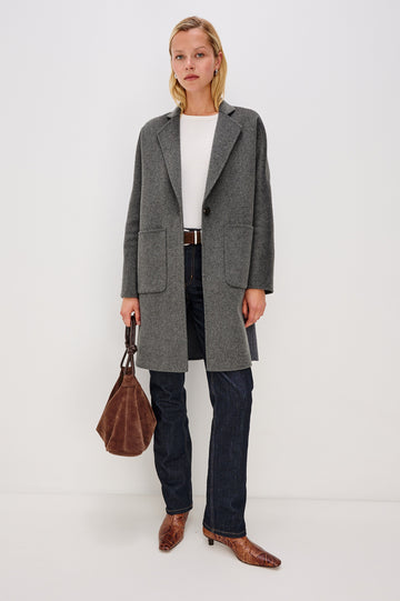 Everest Mid-Thigh Length Coat with Single Button Closure, Notched Lapels and Front Patch Pockets in Charcoal Colorway - Front Full Body View Featured on Model