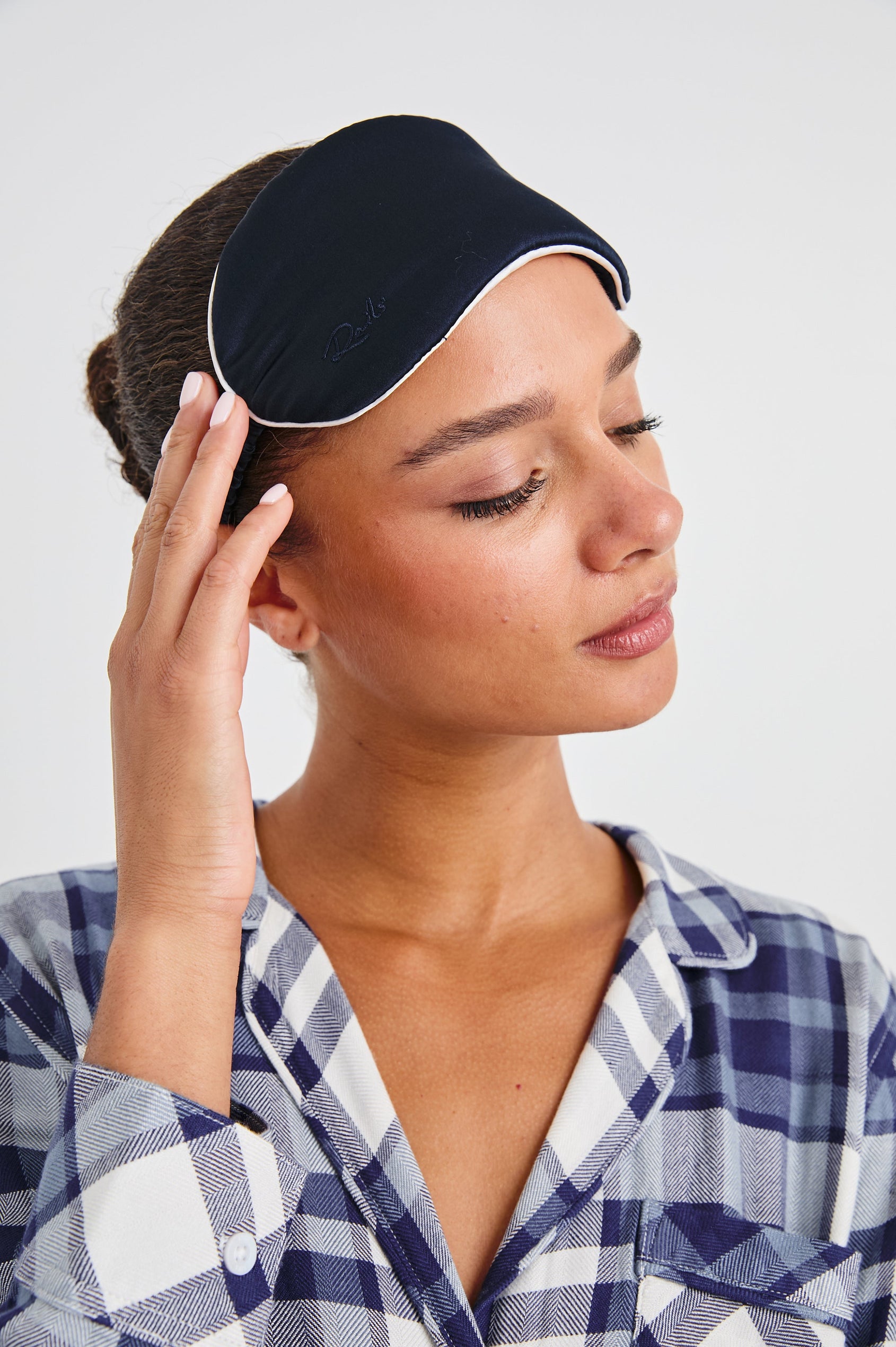 Silk Eye Mask with Elastic Band in Navy White Colorway, White Edging on Navy - Front View Featured on Model