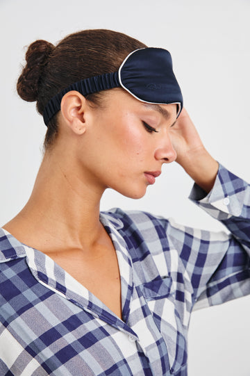 Silk Eye Mask with Elastic Band in Navy White Colorway, White Edging on Navy - Side View Featured on Model