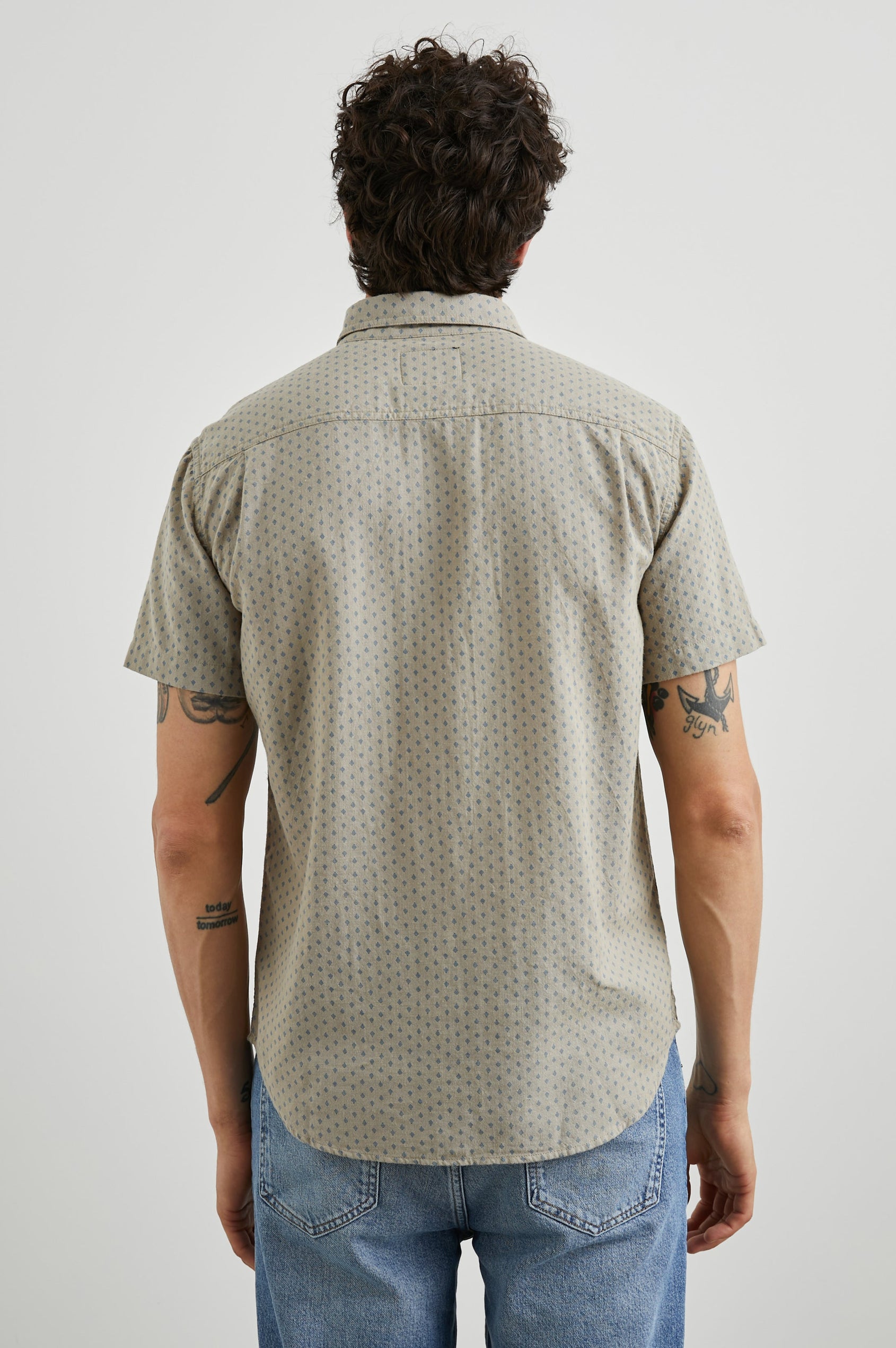 Fairfax Short-Sleeve Button Up with a Chest Patch Pocket in Polygon Micro Quinoa Colorway, with small Grey polygons on Quinoa - Back View Featured on Model