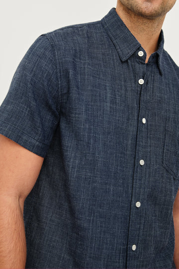 Fairfax short sleeve relaxed fit button up shirt with collar and chest pocket in Navy Etch - close up of details on model