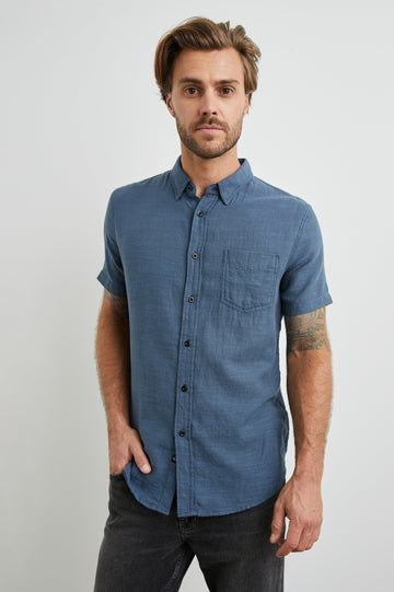 Fairfax Short-Sleeve Button Up with a Chest Patch Pocket in Sea Blue Colorway - Front View Featured on Model