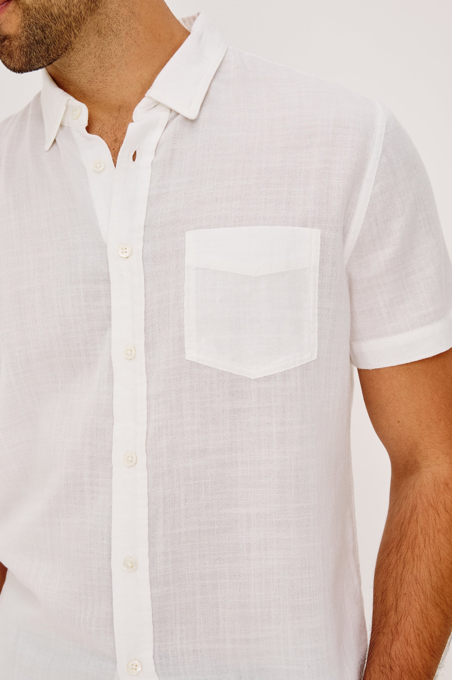 Fairfax Short Sleeve Button-Up Shirt in Lightweight Cotton With a Classic Fit in White Colorway - Upper Body Front Close Up View Featured on Model