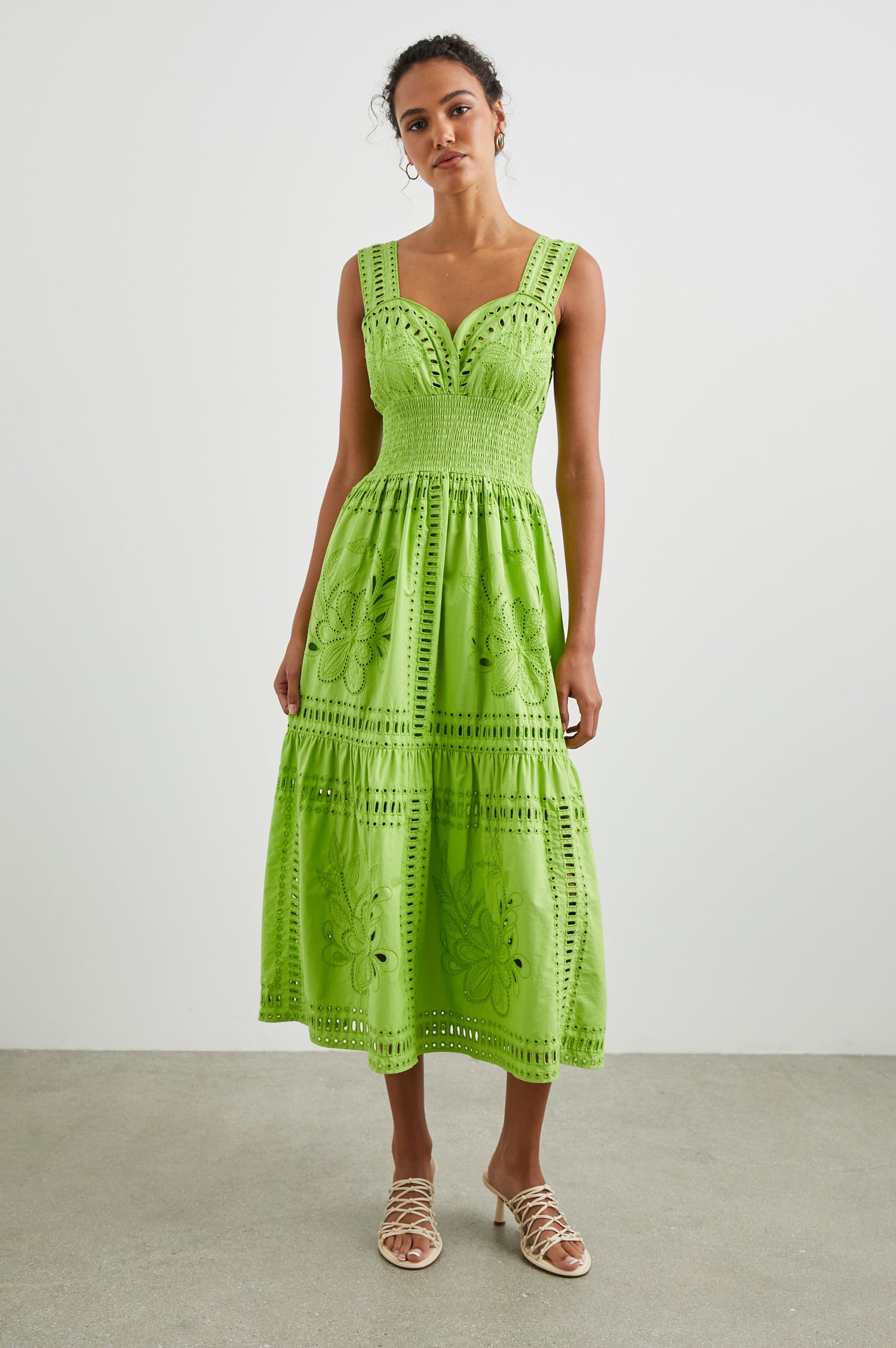 Fawn Sleeveless Midi Dress with Wide Straps, a Sweetheart Neckline, a Cinched Waist and Floral and Geometric Eyelet Details in Island Green Colorway - Front Full Body View Featured on Model