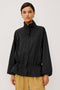 Felix Jacket in Cotton Nylon With Snap-Button Stand Collar, Front Zip-and-Snap Closures, Elastic Cuffs, Long Sleeves, and Drawcord Sides in Black Colorway - Upper Body Front View Featured on Model